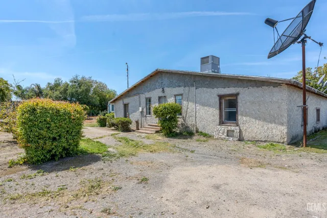 a bedroom with a bed and a cabinets
