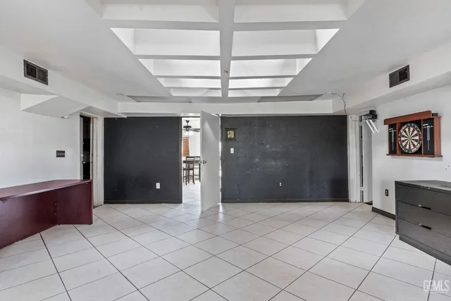 a swimming pool with outdoor seating and yard