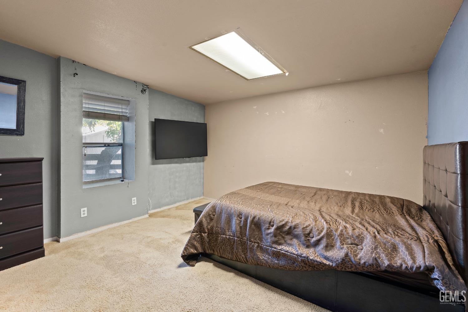 Undisclosed Address Delano, CA 93215 - Photo 45 of 72 a bedroom with a bed and a flat screen tv