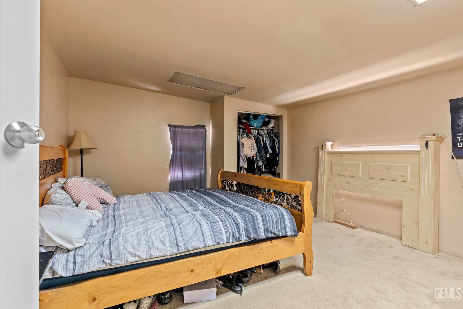 Undisclosed Address Delano, CA 93215 - Photo 48 of 72 a bedroom with a bed and a cabinets