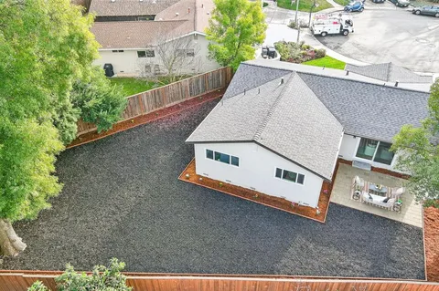 an aerial view of a house with swimming pool