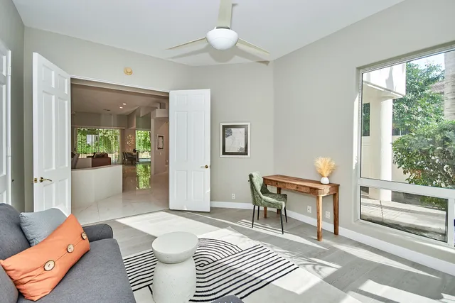 a living room with furniture a window and a table