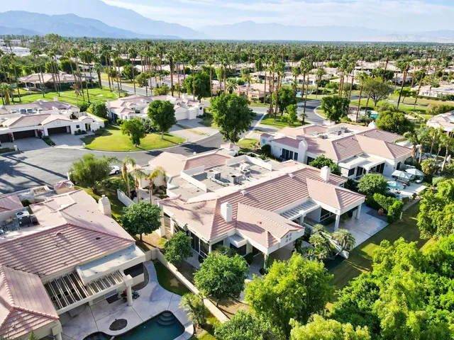 an aerial view of a house with a lake view