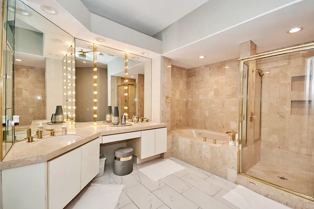 a bathroom with a double vanity sink mirror double and shower