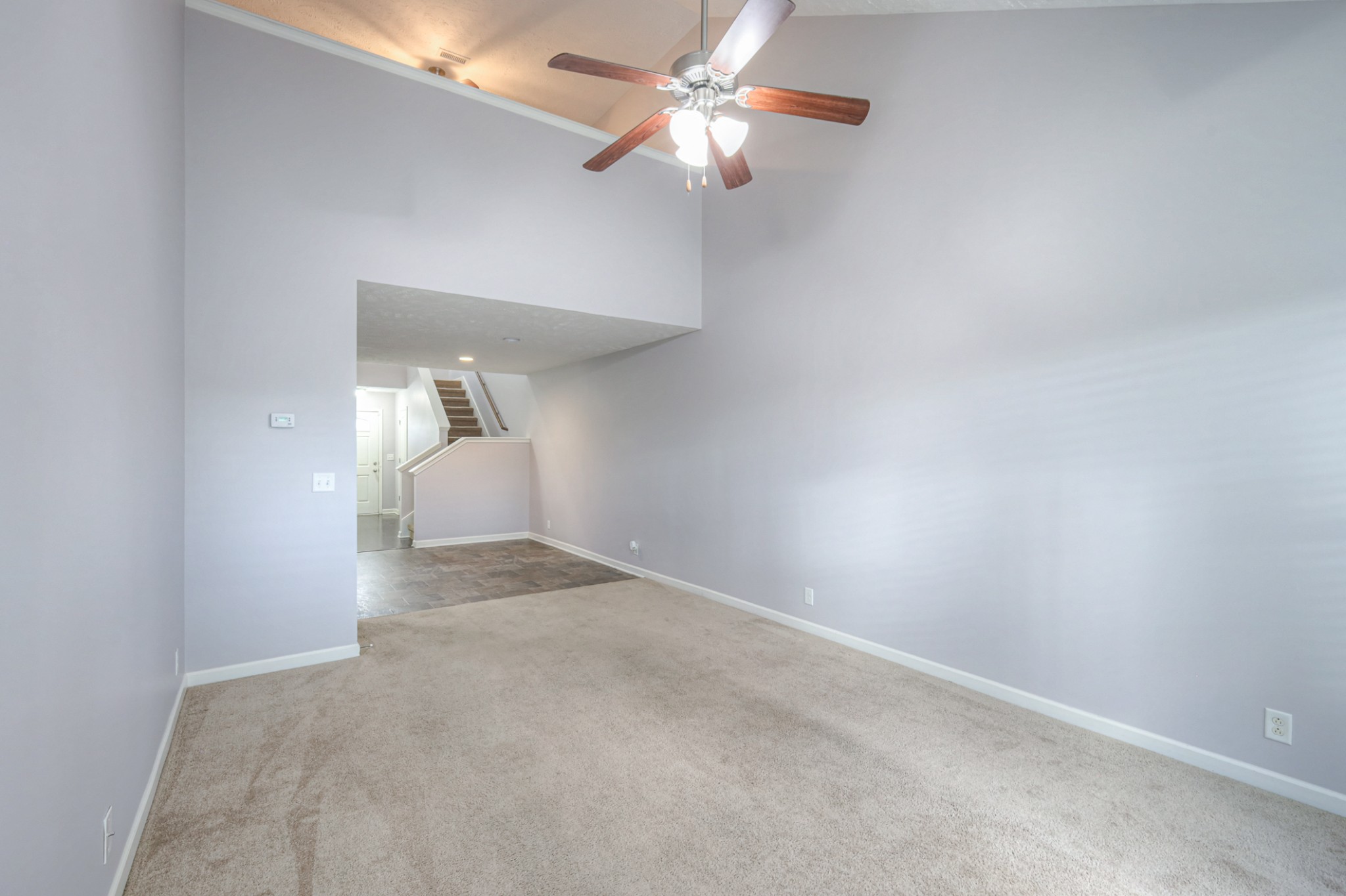 4245 Sunday Silence Way Murfreesboro, TN 37128 - Photo 14 of 39 an empty room with a chandelier fan and closet