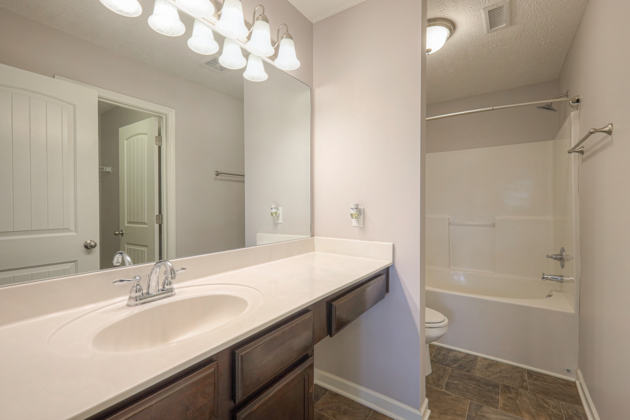 4245 Sunday Silence Way Murfreesboro, TN 37128 - Photo 16 of 39 a bathroom with a sink a toilet and shower