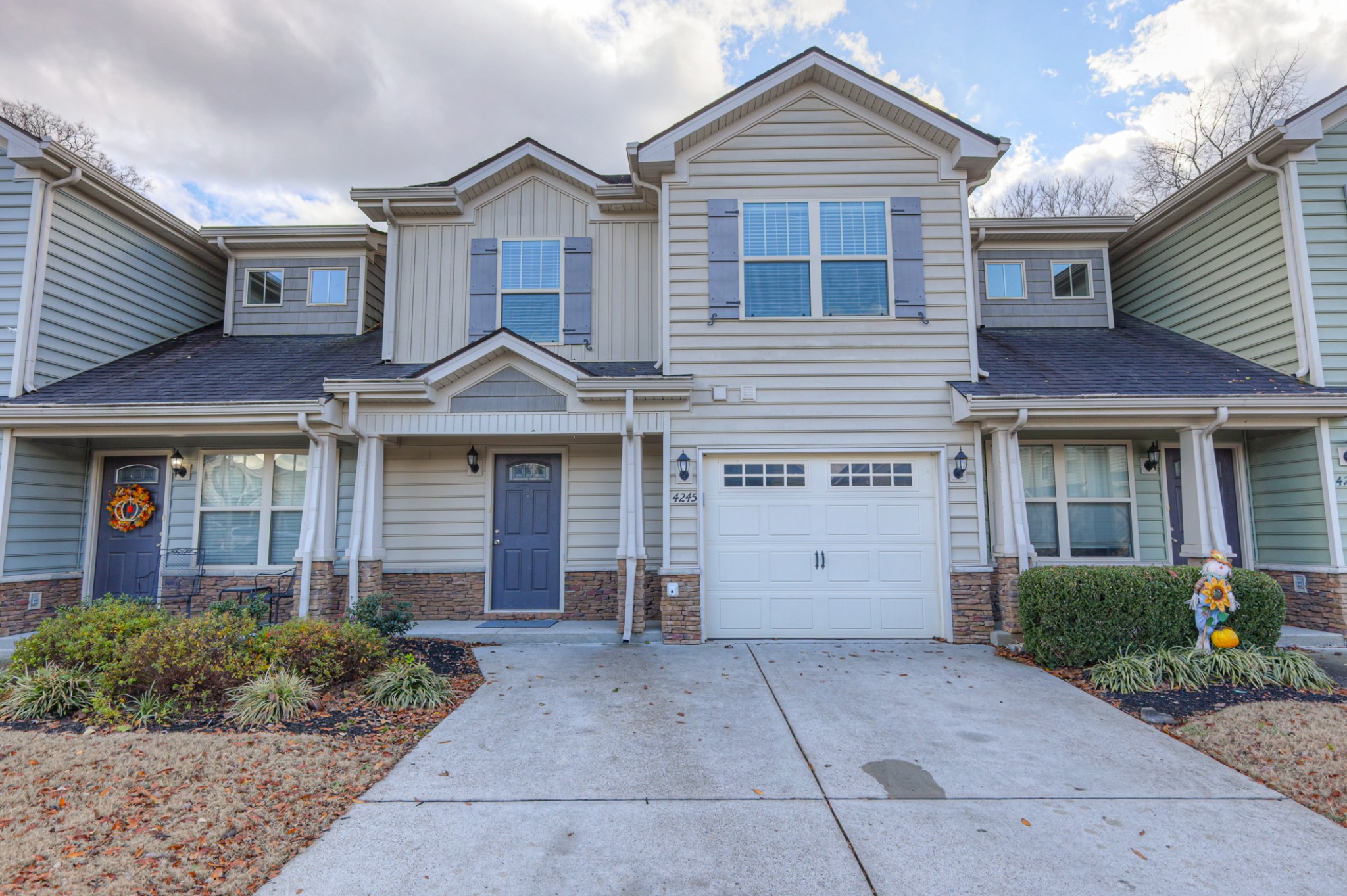 4245 Sunday Silence Way Murfreesboro, TN 37128 - Photo 2 of 39 a front view of a house with garden