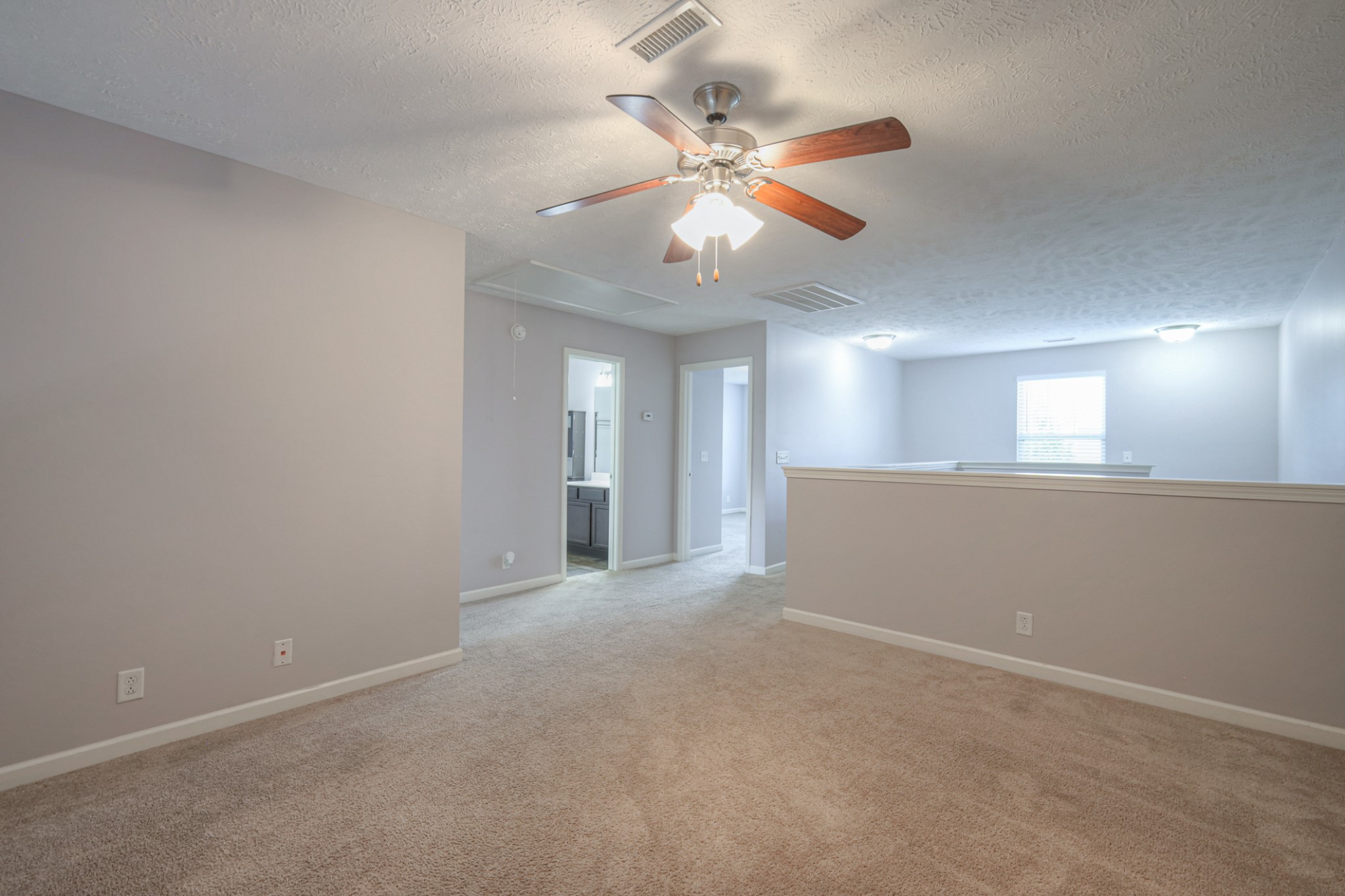 4245 Sunday Silence Way Murfreesboro, TN 37128 - Photo 25 of 39 a view of an empty room with a chandelier fan
