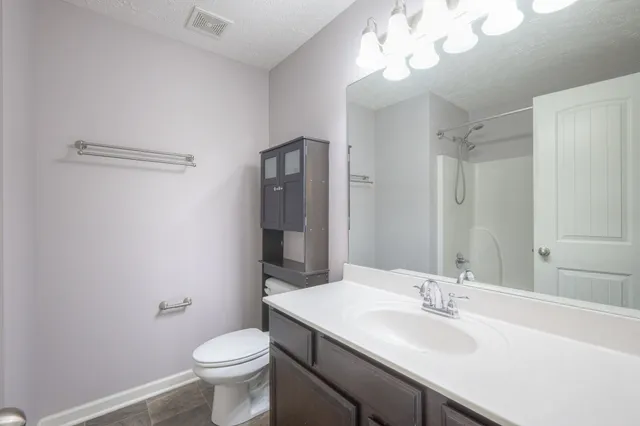 a bathroom with a shower and a bath tub