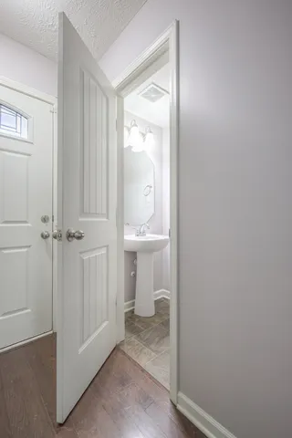 a bathroom with a sink and mirror