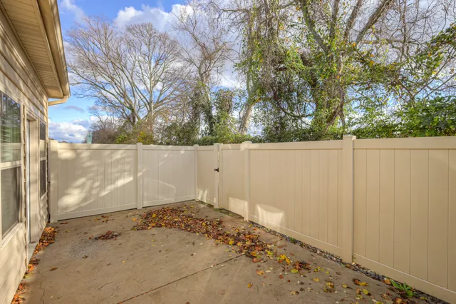 a view of a blue house with a large window