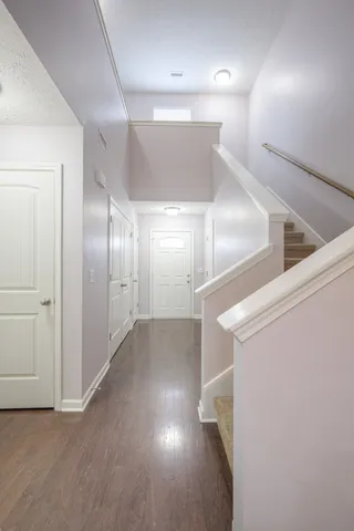 a kitchen with a refrigerator and a sink