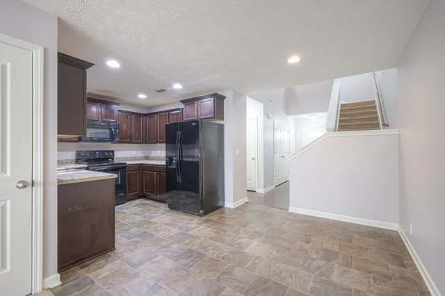 a view of a kitchen with a sink and a stove