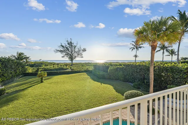 a view of a swimming pool and a yard