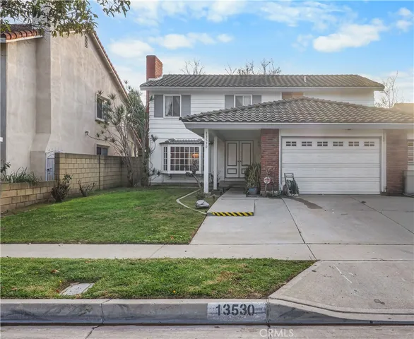 a view of house with yard