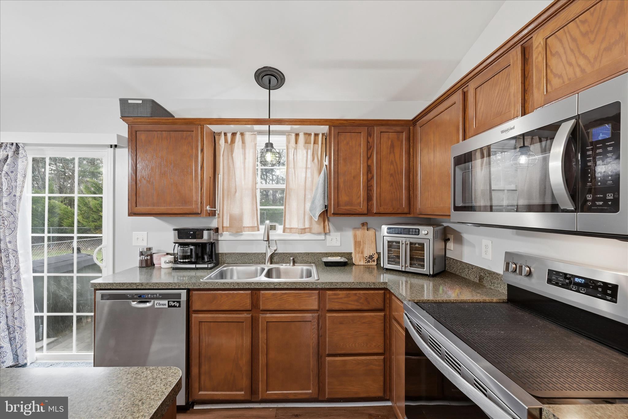 212 Freight Car Circle Inwood, WV 25428 - Photo 13 of 41 a kitchen with stainless steel appliances a sink stove and cabinets