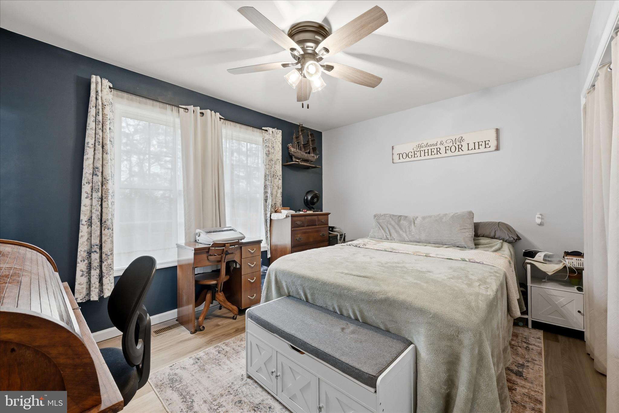 212 Freight Car Circle Inwood, WV 25428 - Photo 14 of 41 a bedroom with a bed and a chandelier