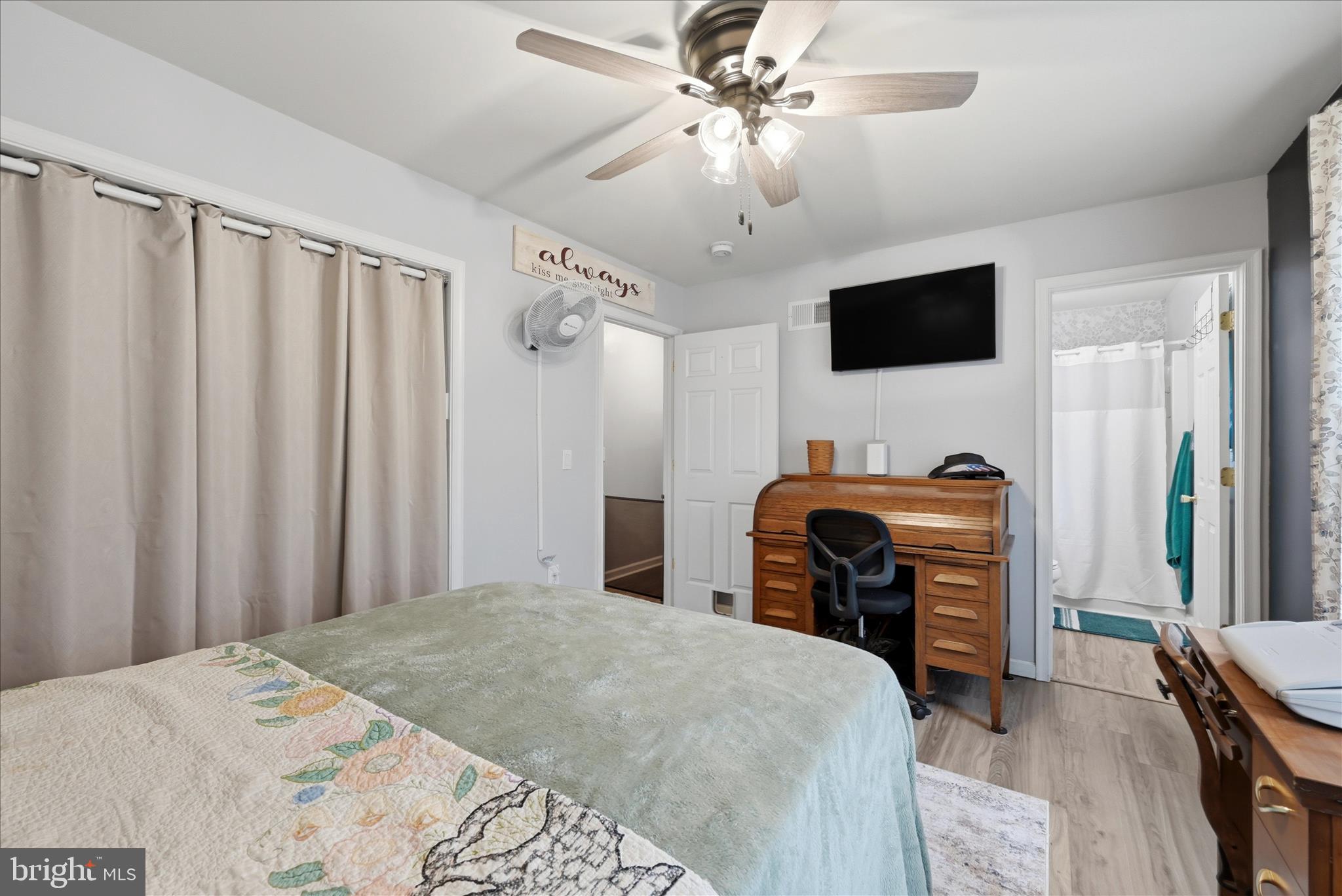 212 Freight Car Circle Inwood, WV 25428 - Photo 16 of 41 a bedroom with a bed and a flat screen tv