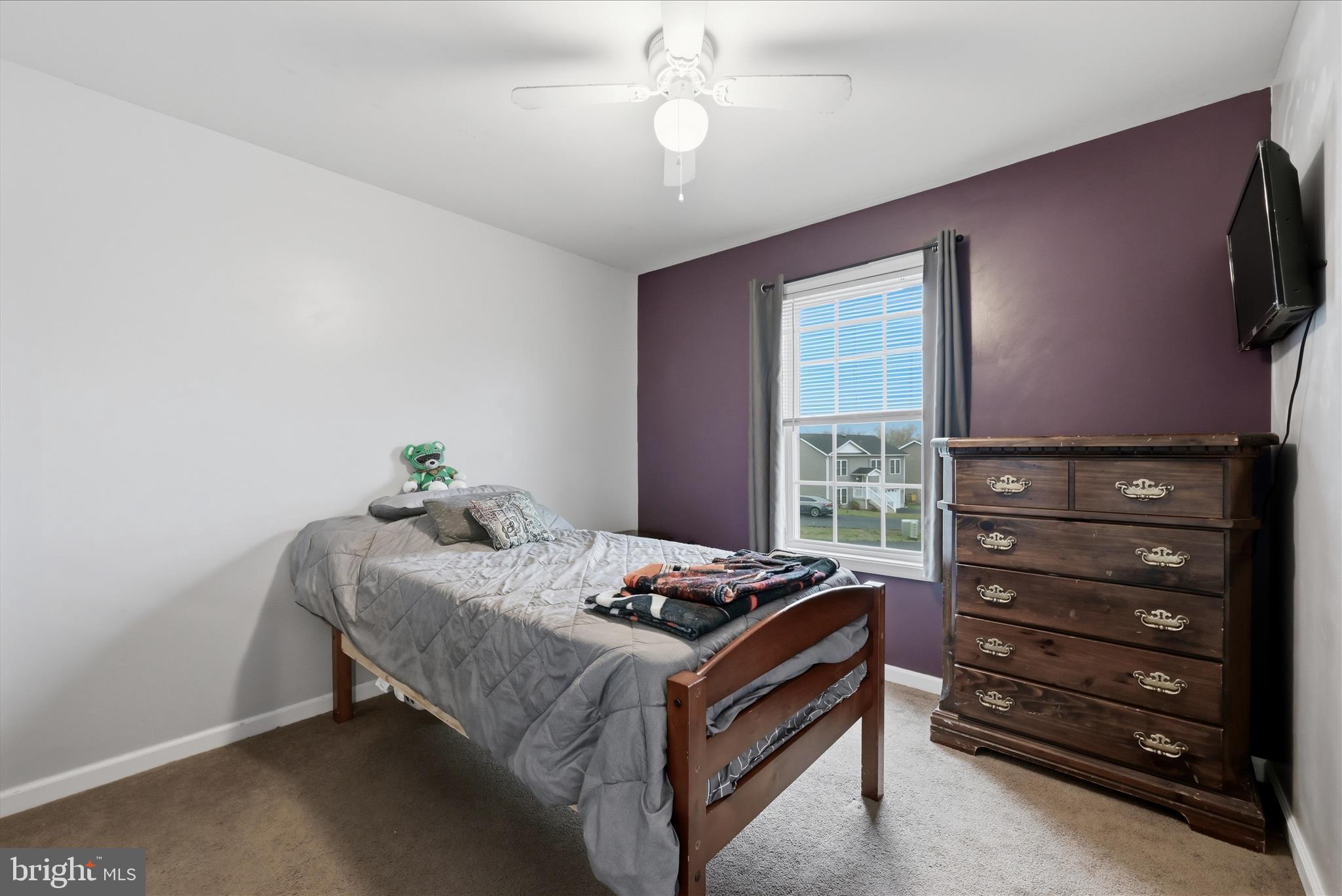 212 Freight Car Circle Inwood, WV 25428 - Photo 19 of 41 a bedroom with a bed and a flat screen tv