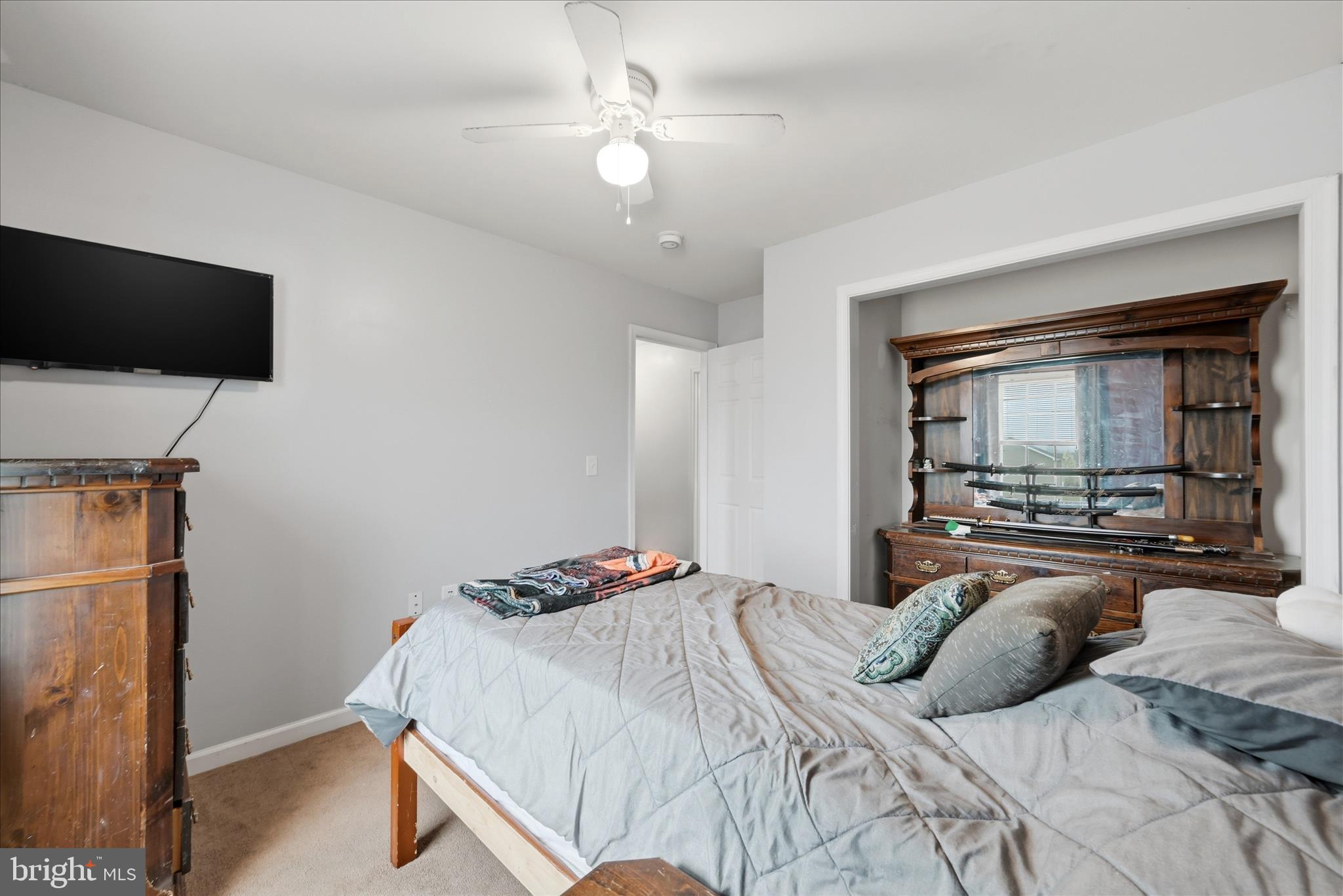 212 Freight Car Circle Inwood, WV 25428 - Photo 20 of 41 a bedroom with a bed and a flat screen tv