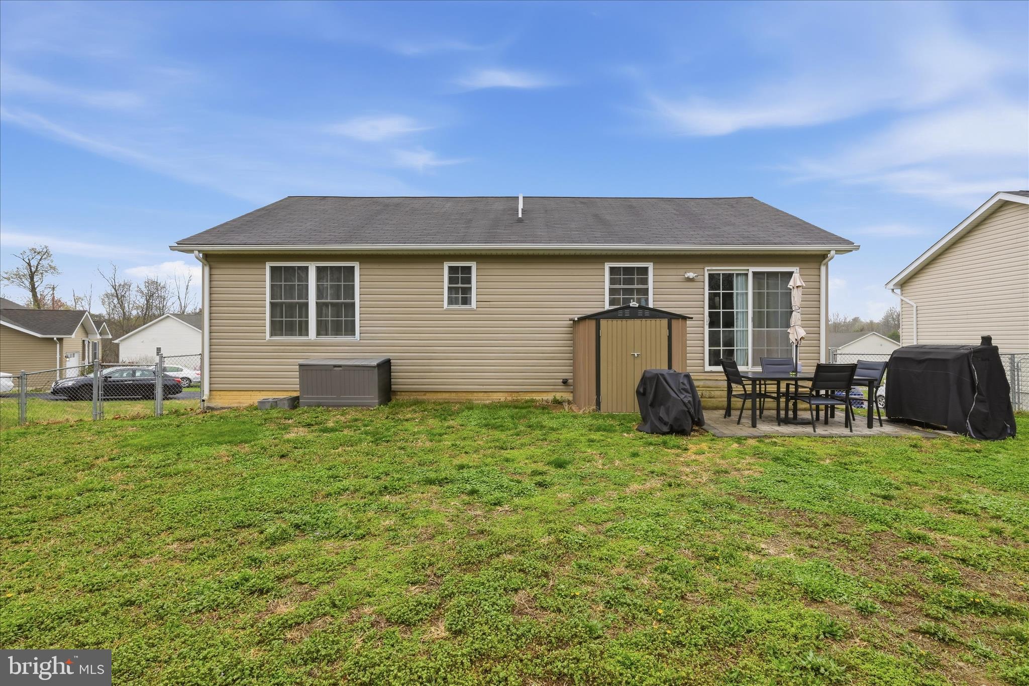 212 Freight Car Circle Inwood, WV 25428 - Photo 2 of 41 a view of a house with a yard and chairs
