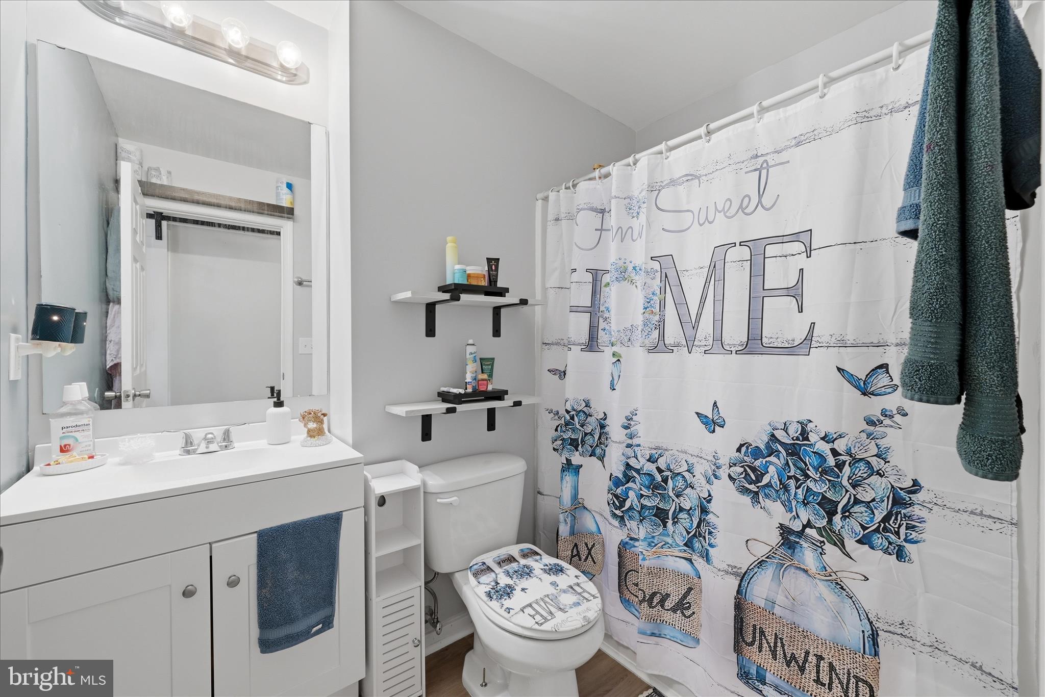 212 Freight Car Circle Inwood, WV 25428 - Photo 21 of 41 a bathroom with a sink a toilet and a mirror