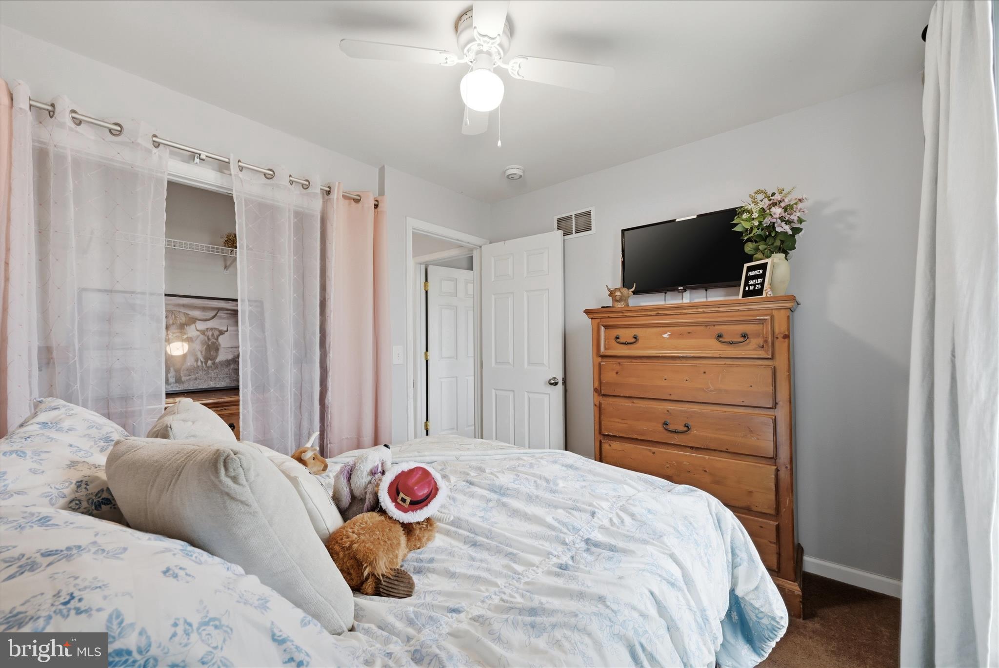 212 Freight Car Circle Inwood, WV 25428 - Photo 23 of 41 a bedroom with a bed and wooden floor