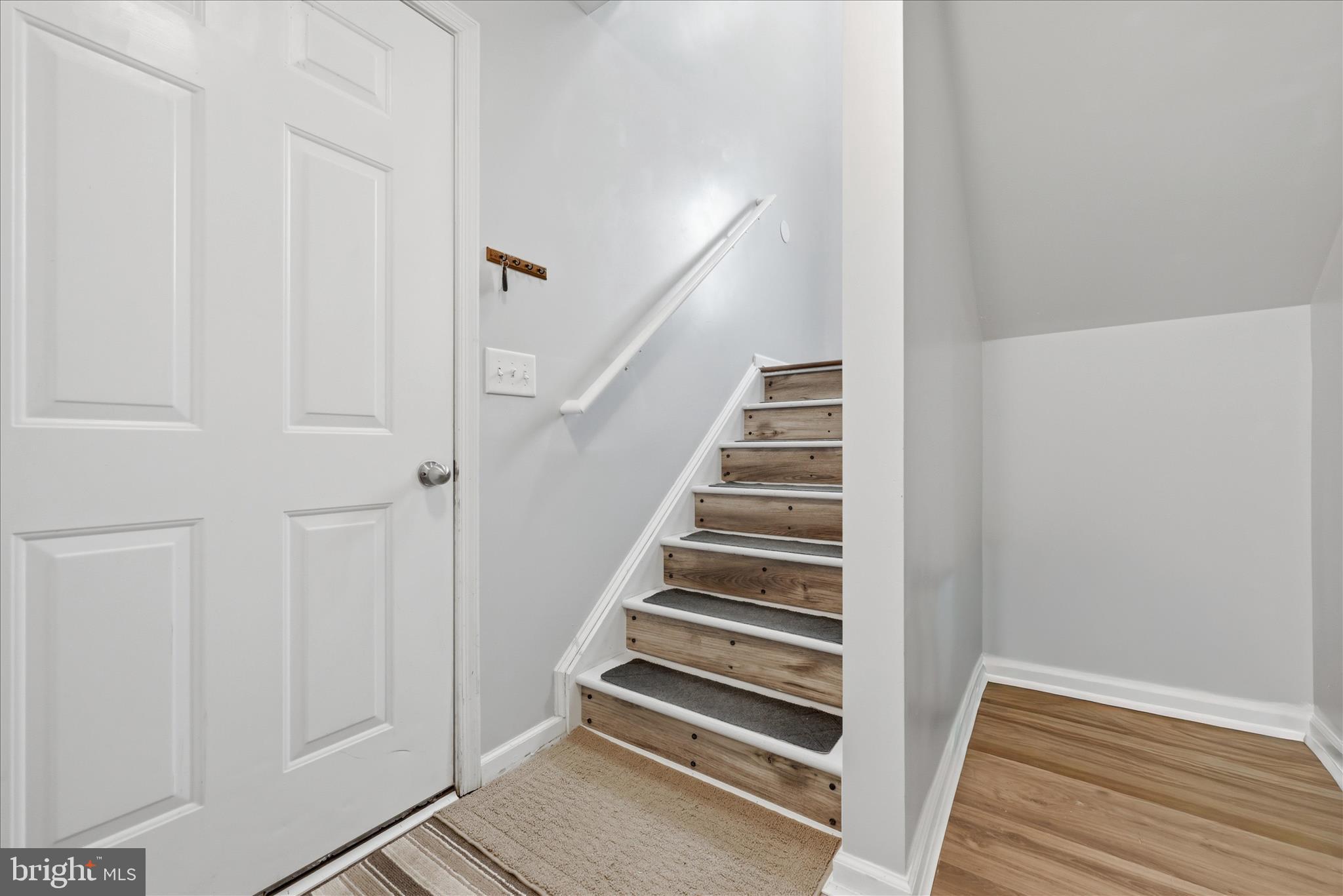 212 Freight Car Circle Inwood, WV 25428 - Photo 24 of 41 a view of entryway with wooden floor
