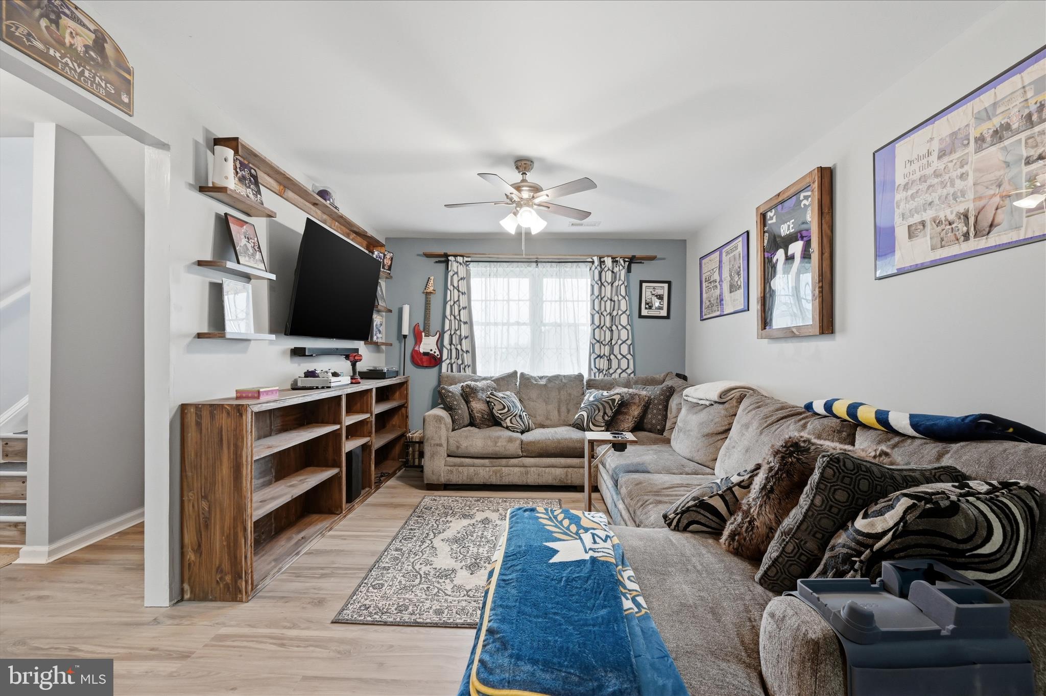 212 Freight Car Circle Inwood, WV 25428 - Photo 26 of 41 a living room with furniture and a flat screen tv