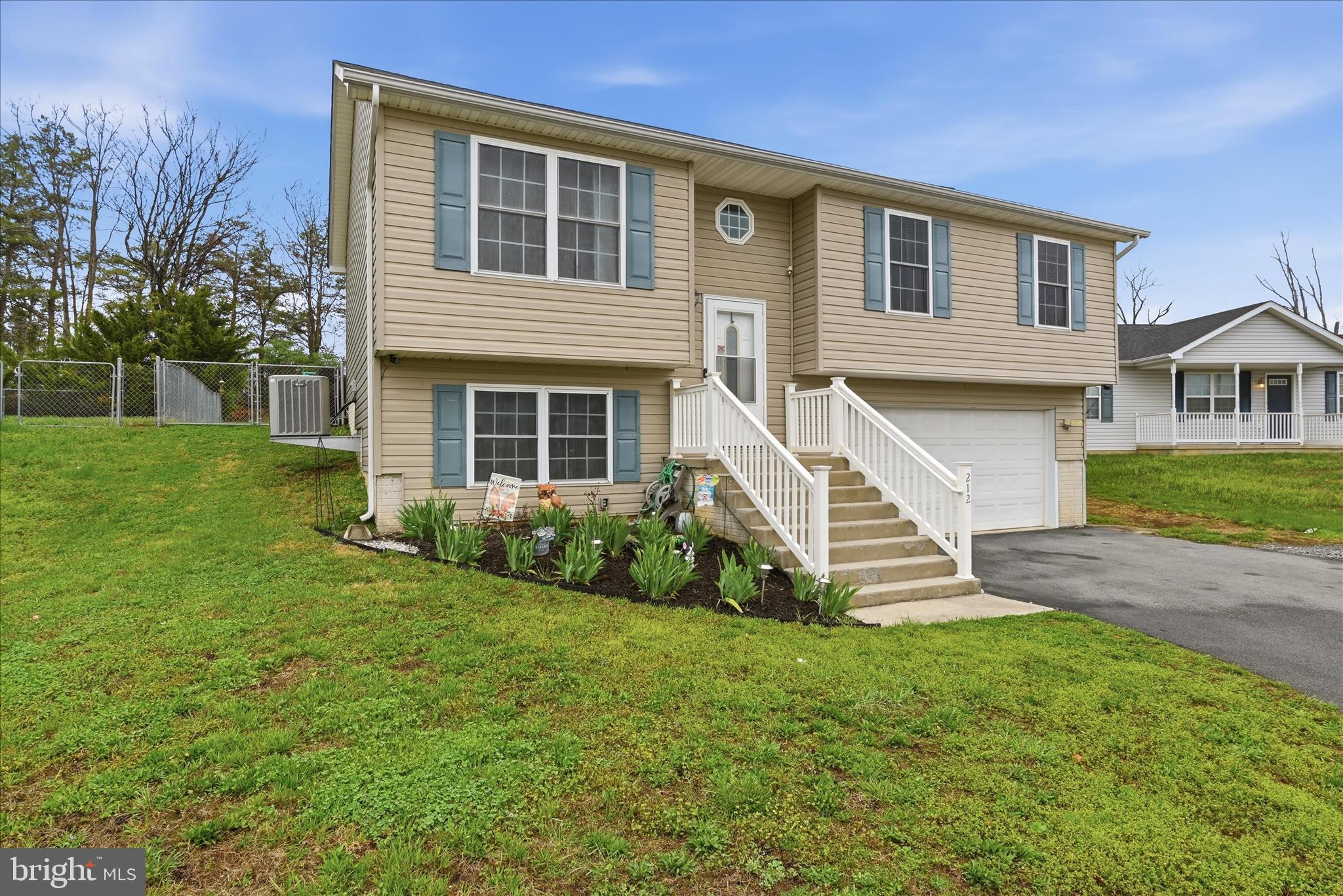 212 Freight Car Circle Inwood, WV 25428 - Photo 32 of 41 a front view of a house with a yard and porch