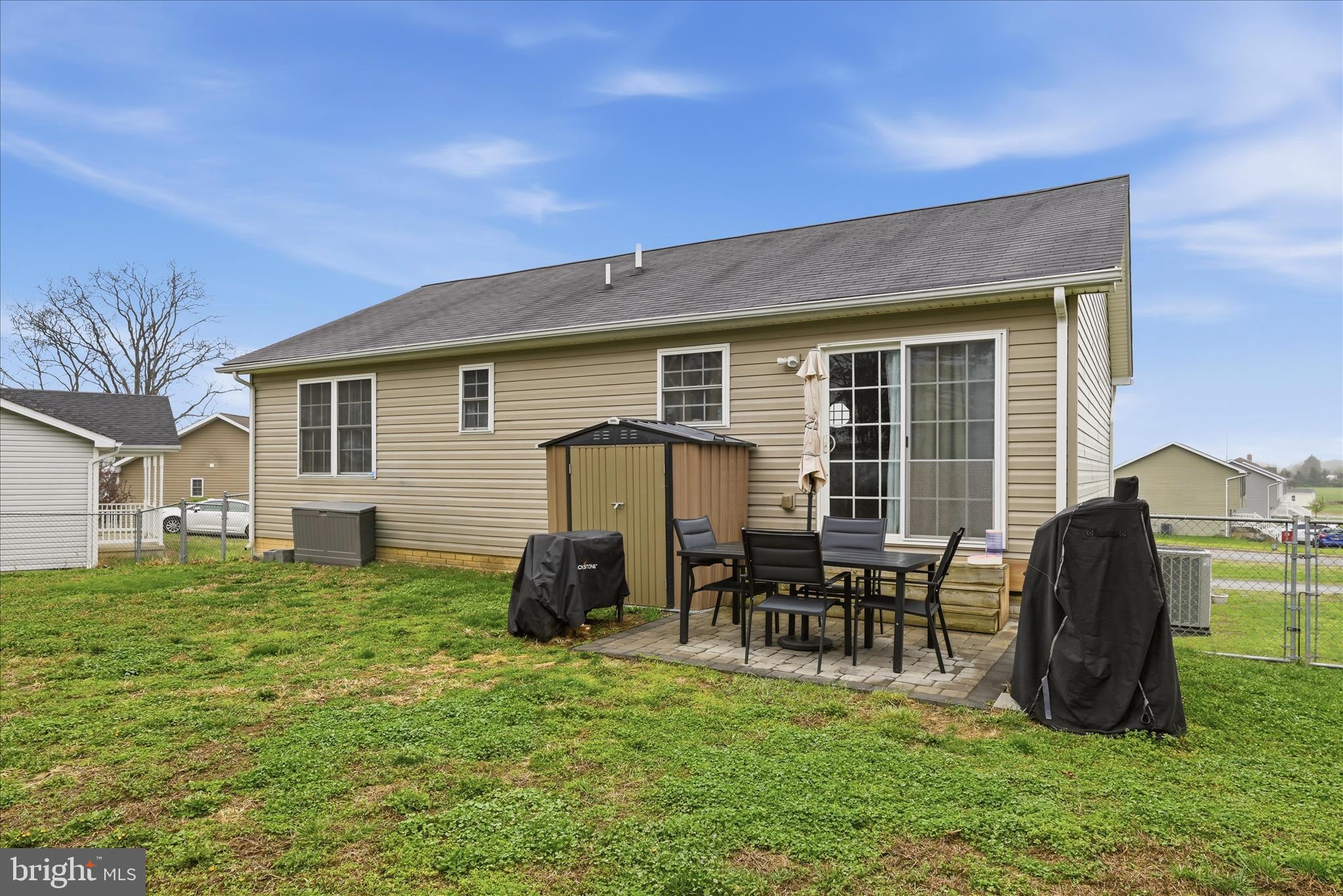 212 Freight Car Circle Inwood, WV 25428 - Photo 34 of 41 a backyard of a house with table and chairs