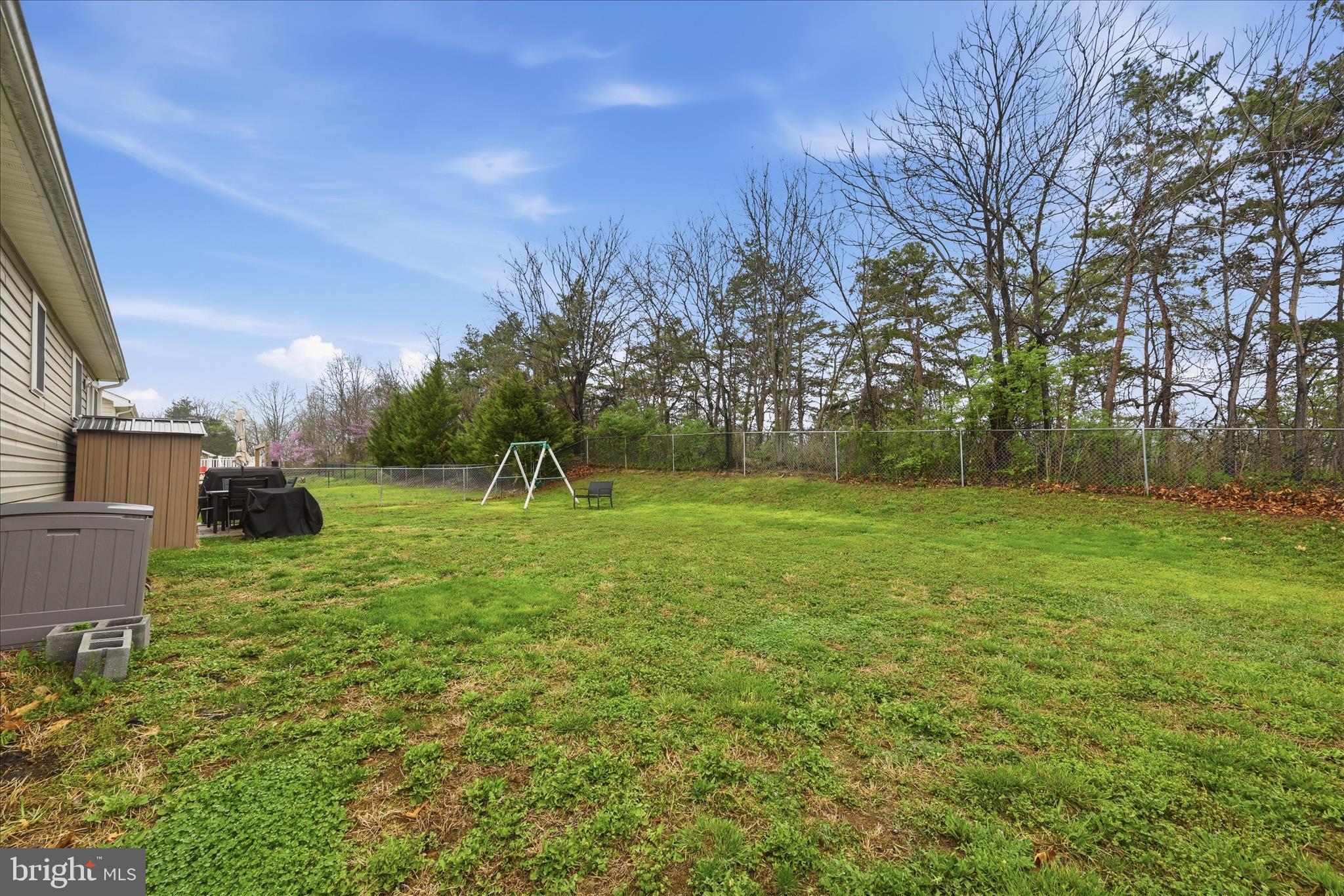 212 Freight Car Circle Inwood, WV 25428 - Photo 37 of 41 a backyard of a house with lots of green space