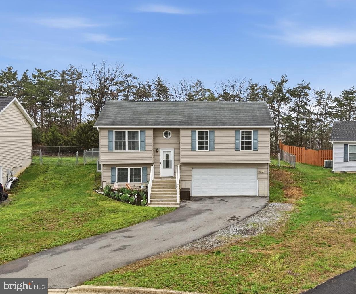 212 Freight Car Circle Inwood, WV 25428 - Photo 38 of 41 front view of a house with a yard