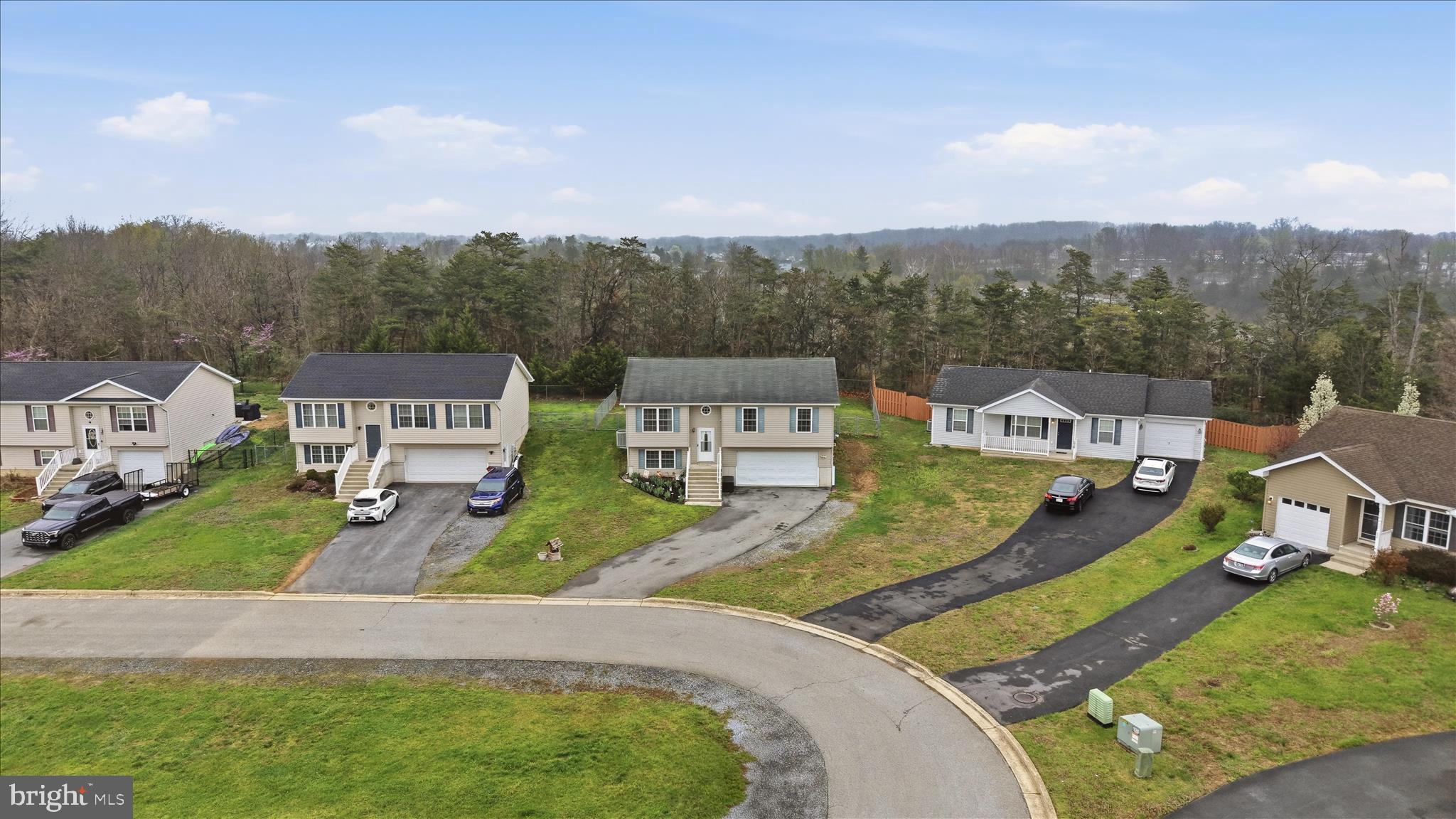 212 Freight Car Circle Inwood, WV 25428 - Photo 39 of 41 an aerial view of a house with swimming pool and mountains