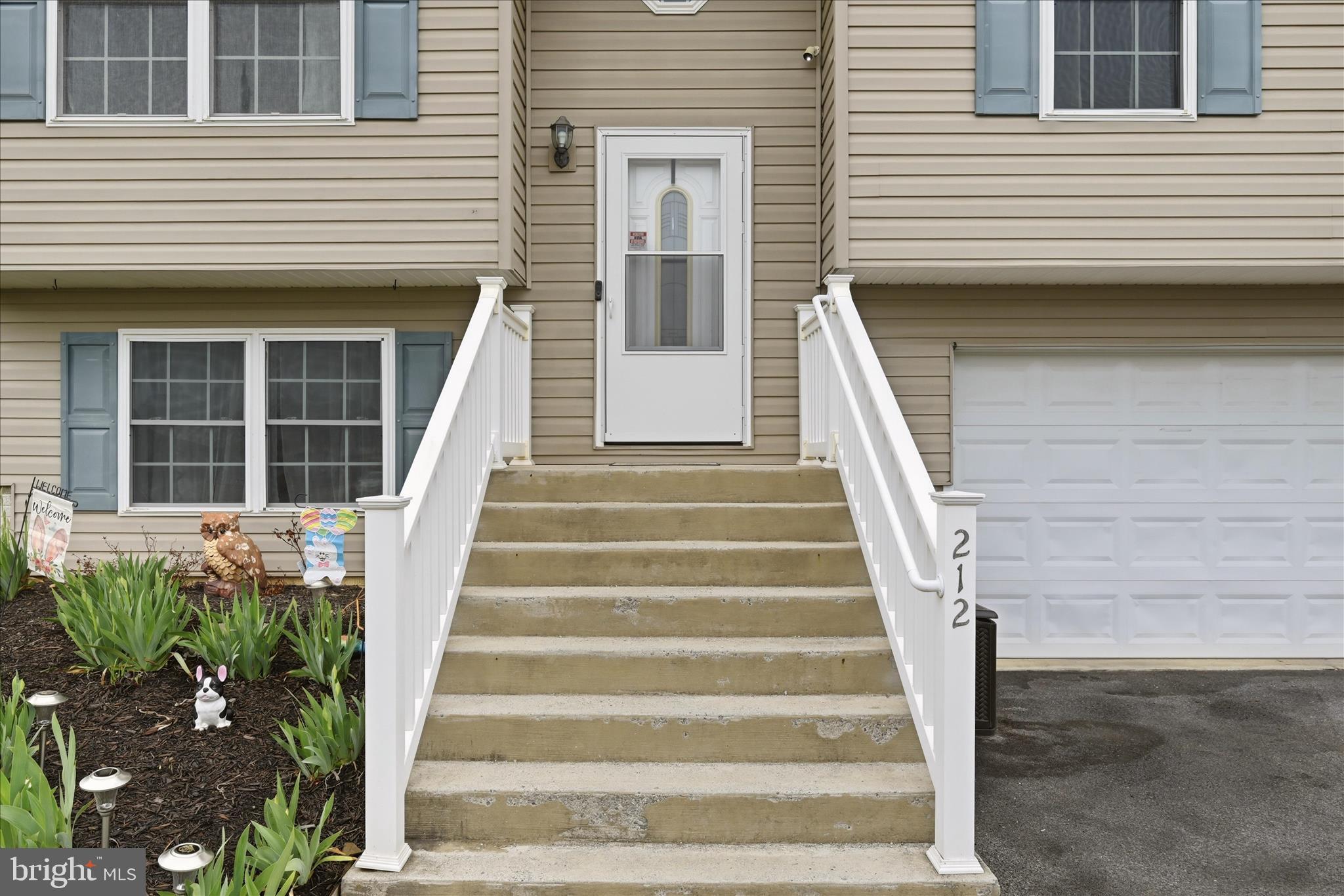 212 Freight Car Circle Inwood, WV 25428 - Photo 4 of 41 a view of a house with entryway and stairs