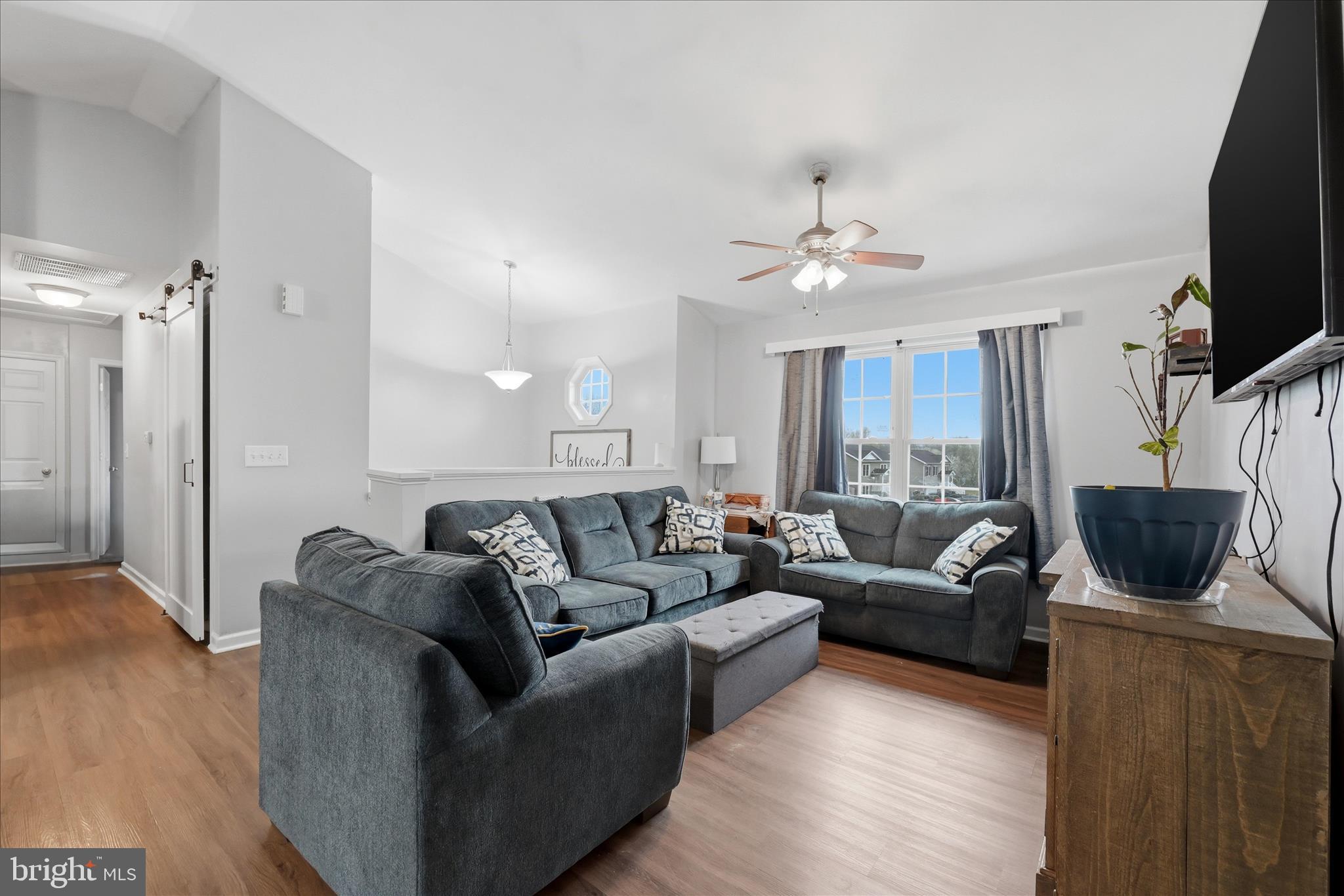 212 Freight Car Circle Inwood, WV 25428 - Photo 6 of 41 a living room with furniture and a flat screen tv