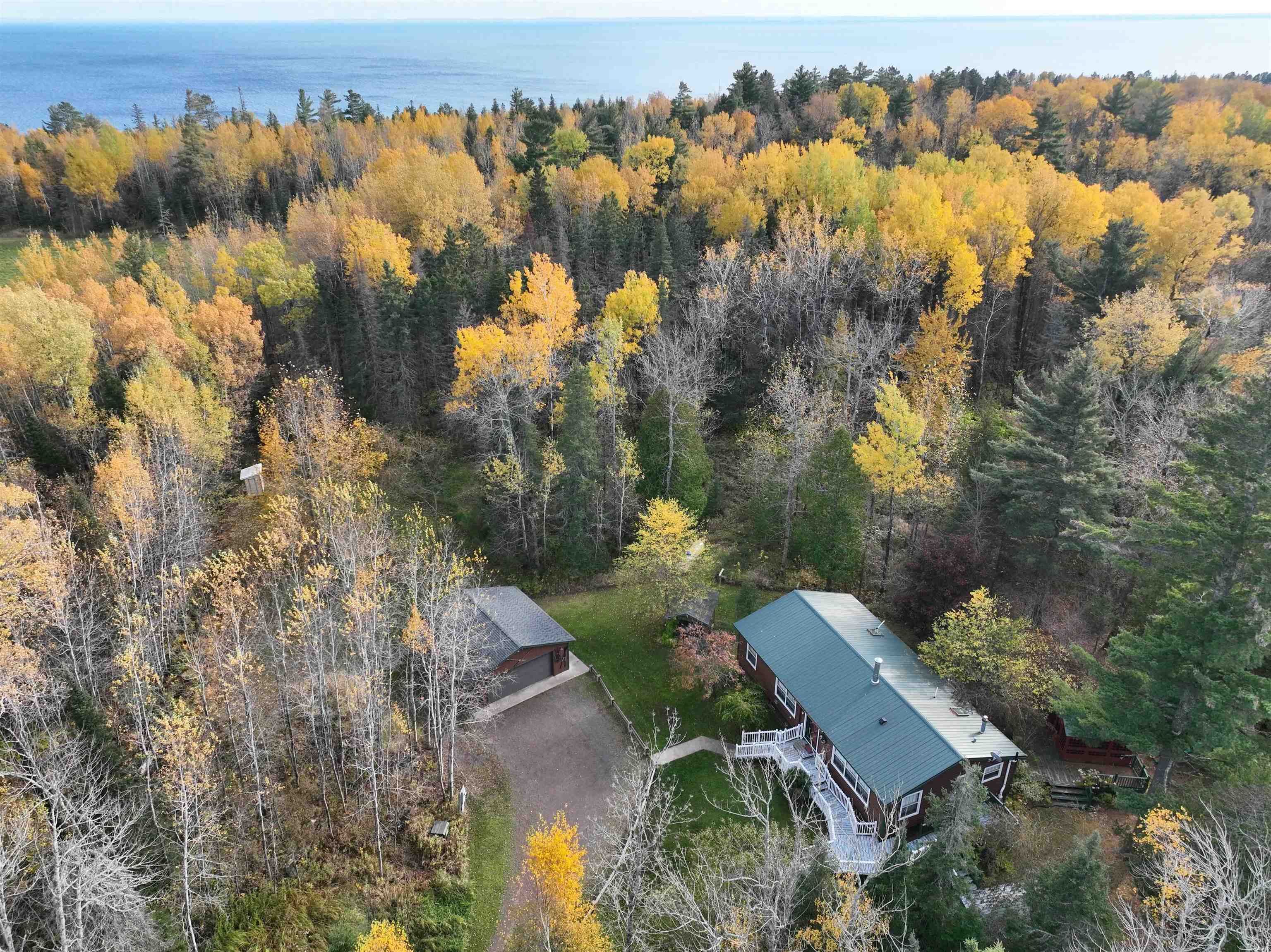 1302 Old North Shore Road Duluth, MN 55804 - Photo 24 of 75 Aerial view of property's location with a large body of water and a heavily wooded area