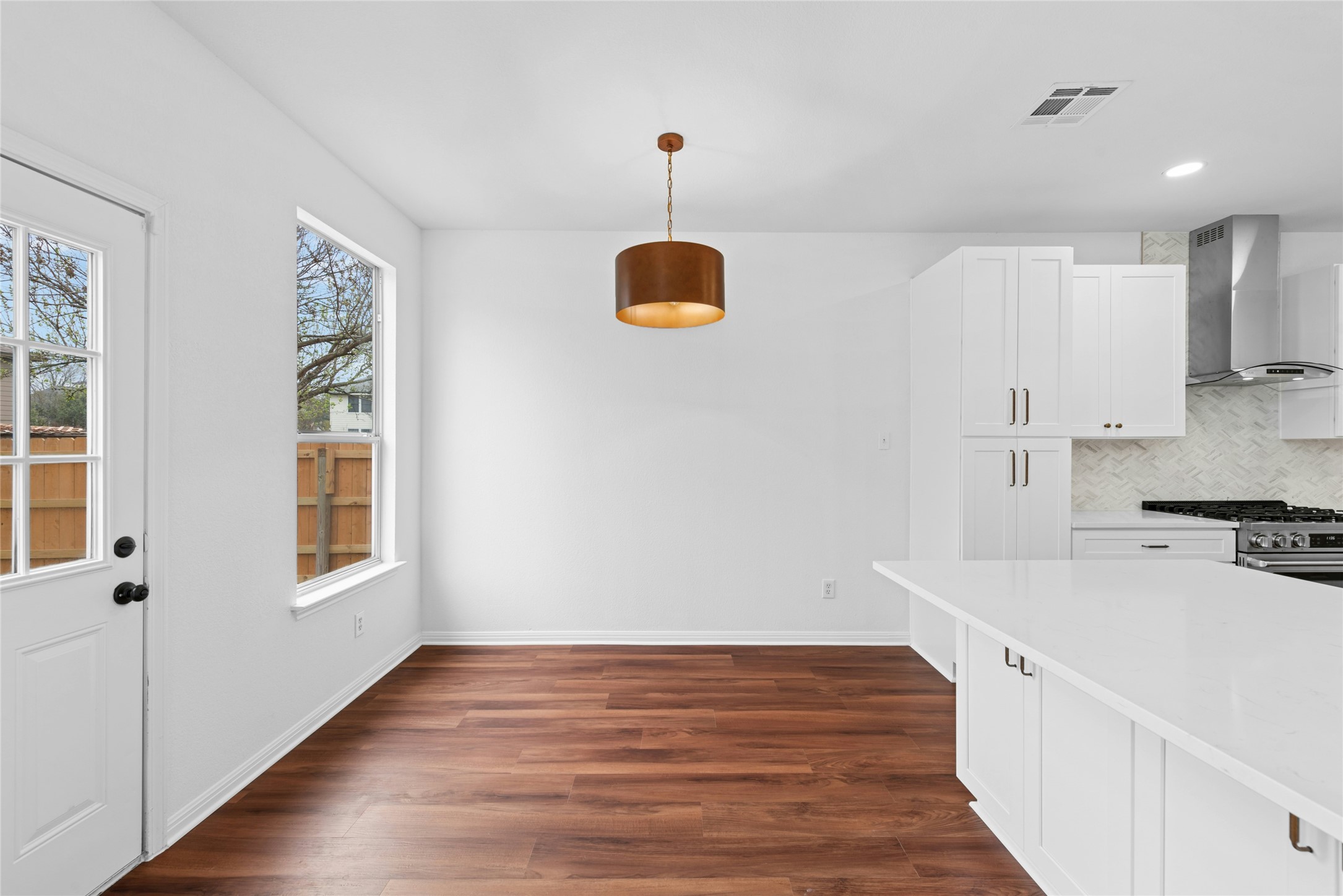 813 Caribou Ridge Trail Pflugerville, TX 78660 - Photo 12 of 39 a kitchen with stainless steel appliances granite countertop a sink a stove and a refrigerator