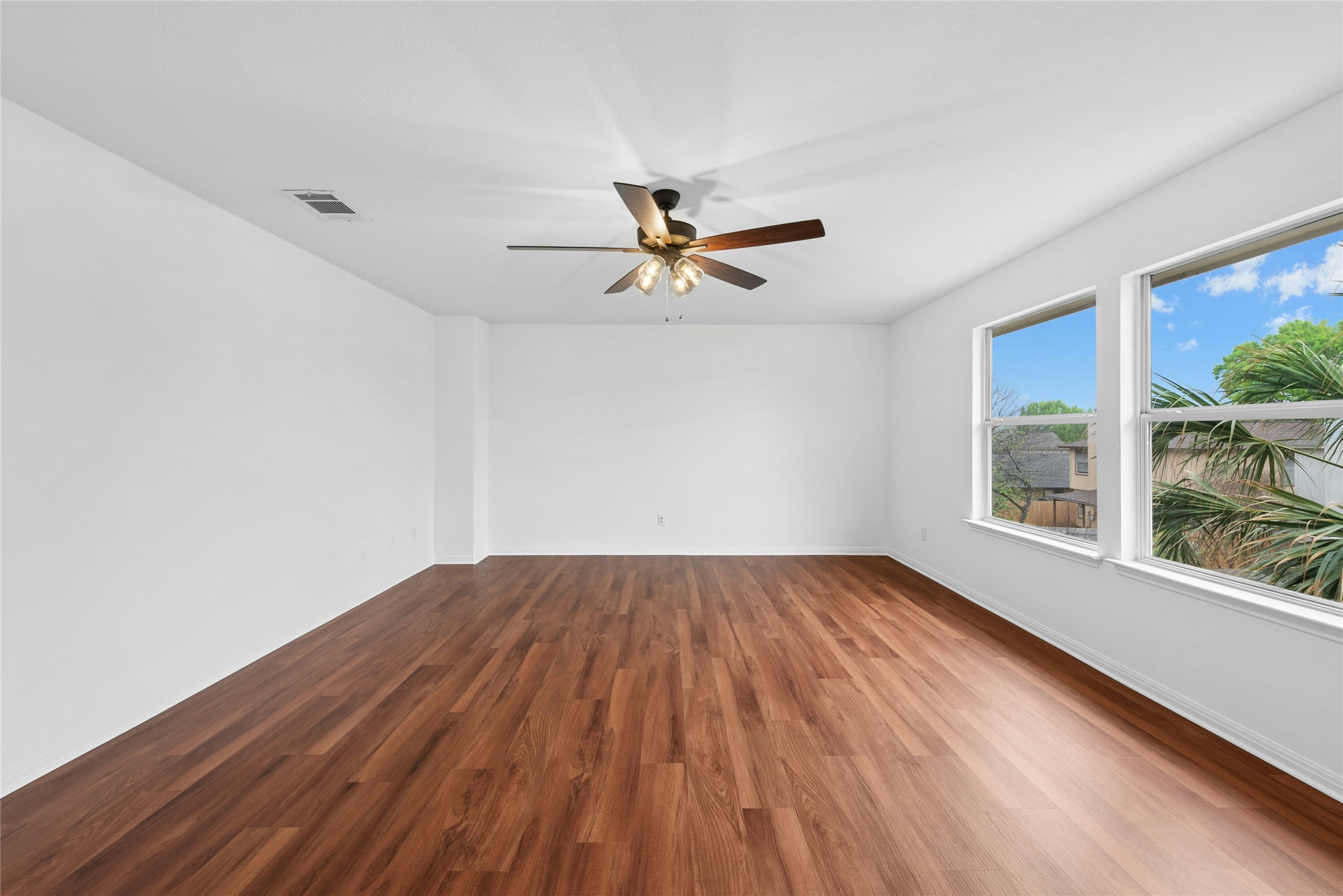 813 Caribou Ridge Trail Pflugerville, TX 78660 - Photo 31 of 39 wooden floor in an empty room with a window