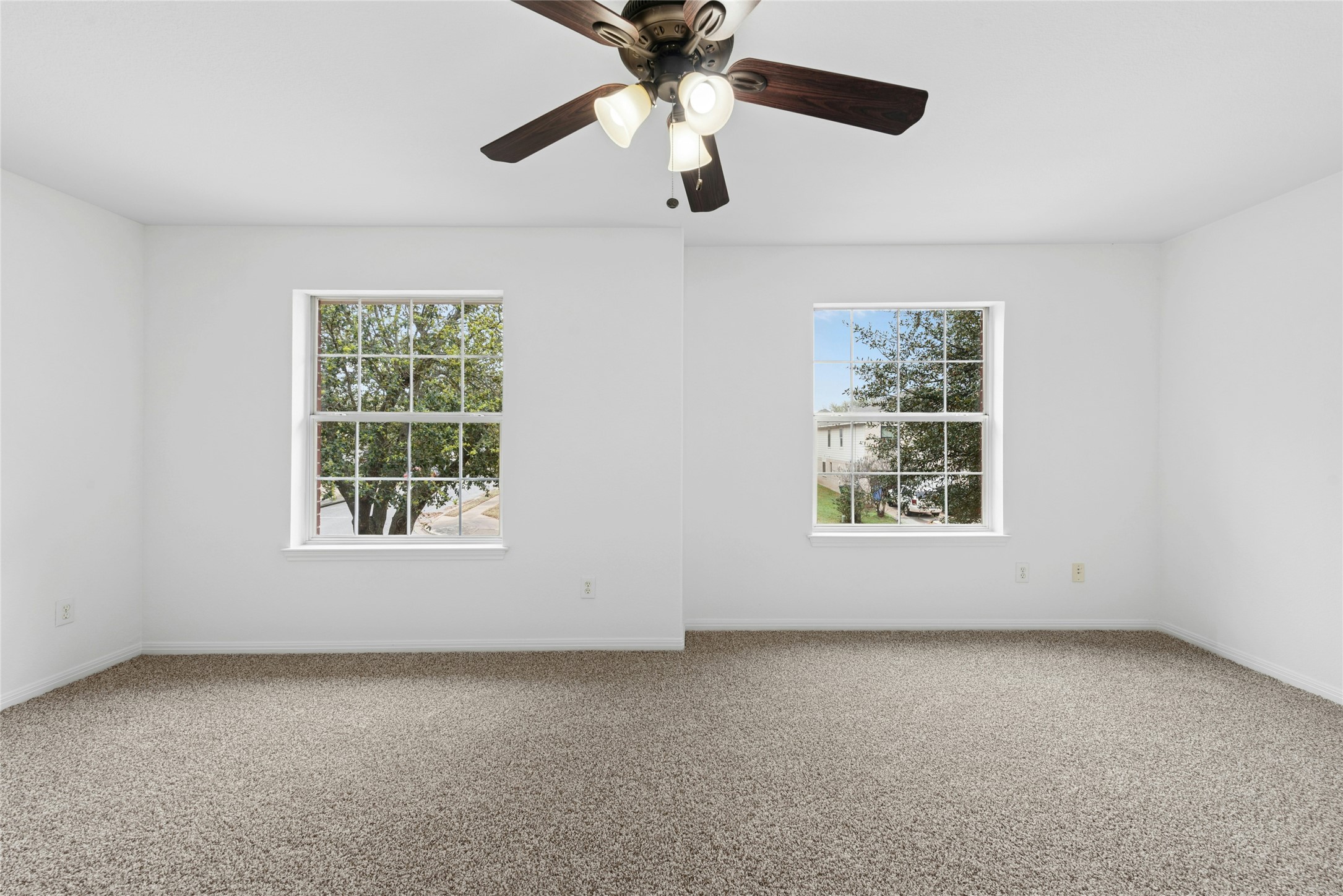 813 Caribou Ridge Trail Pflugerville, TX 78660 - Photo 36 of 39 an empty room with a window and a fan