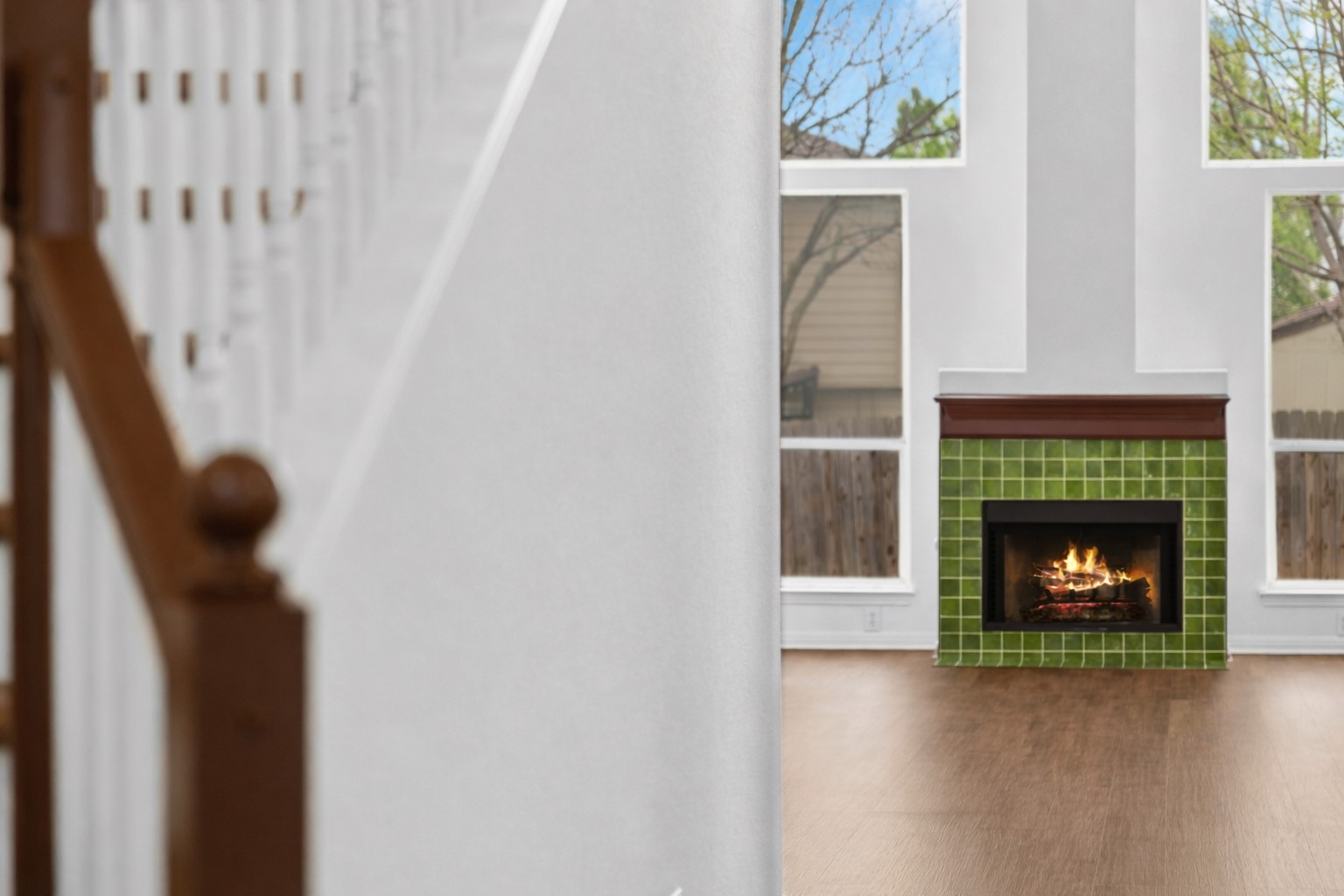 813 Caribou Ridge Trail Pflugerville, TX 78660 - Photo 7 of 39 Striking living room centerpiece showcasing a warm emerald green tiled fireplace.