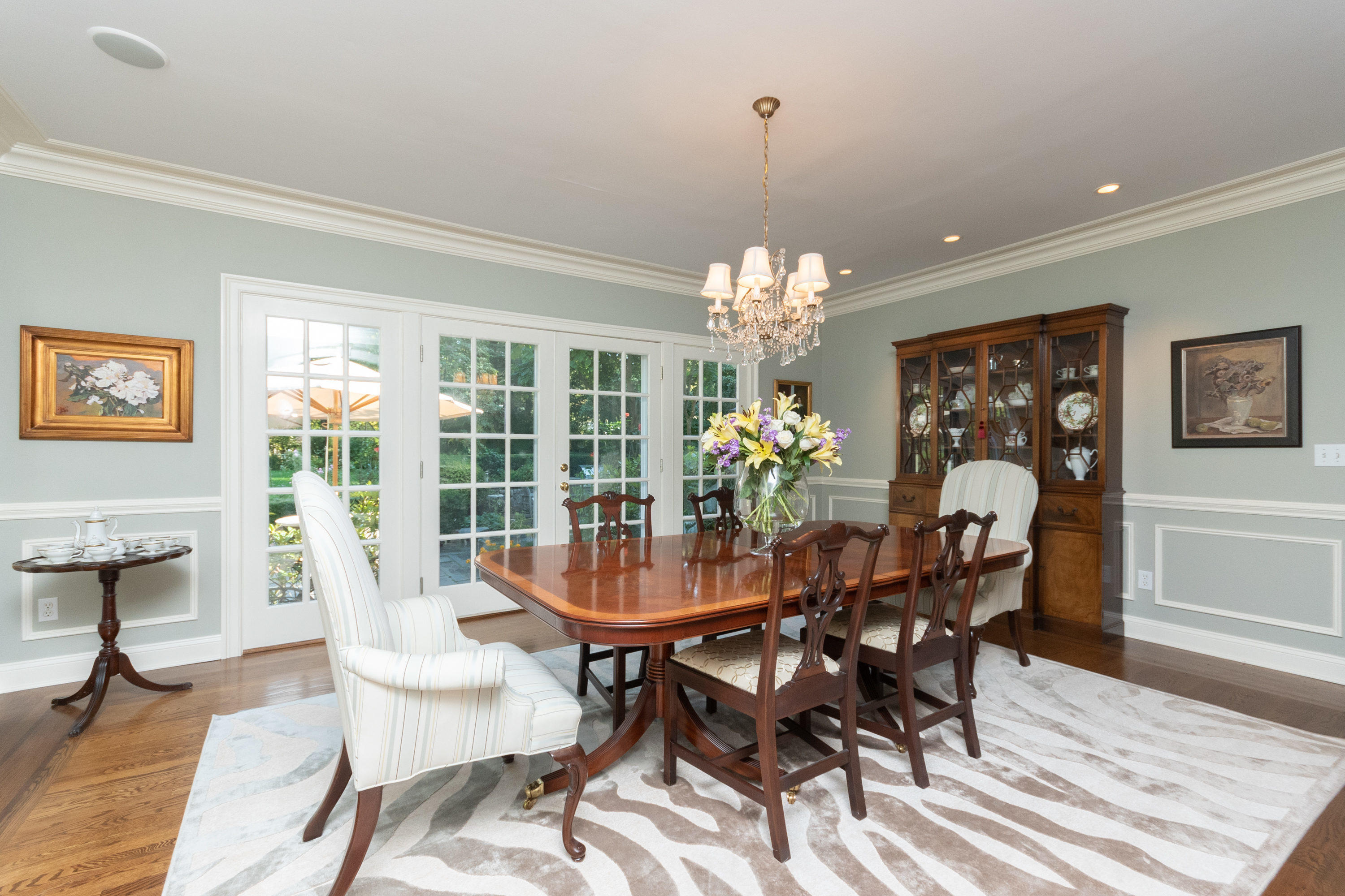 16 Shagbark Road Darien, CT 06820 - Photo 14 of 55 a view of a dining room with furniture a chandelier and wooden floor