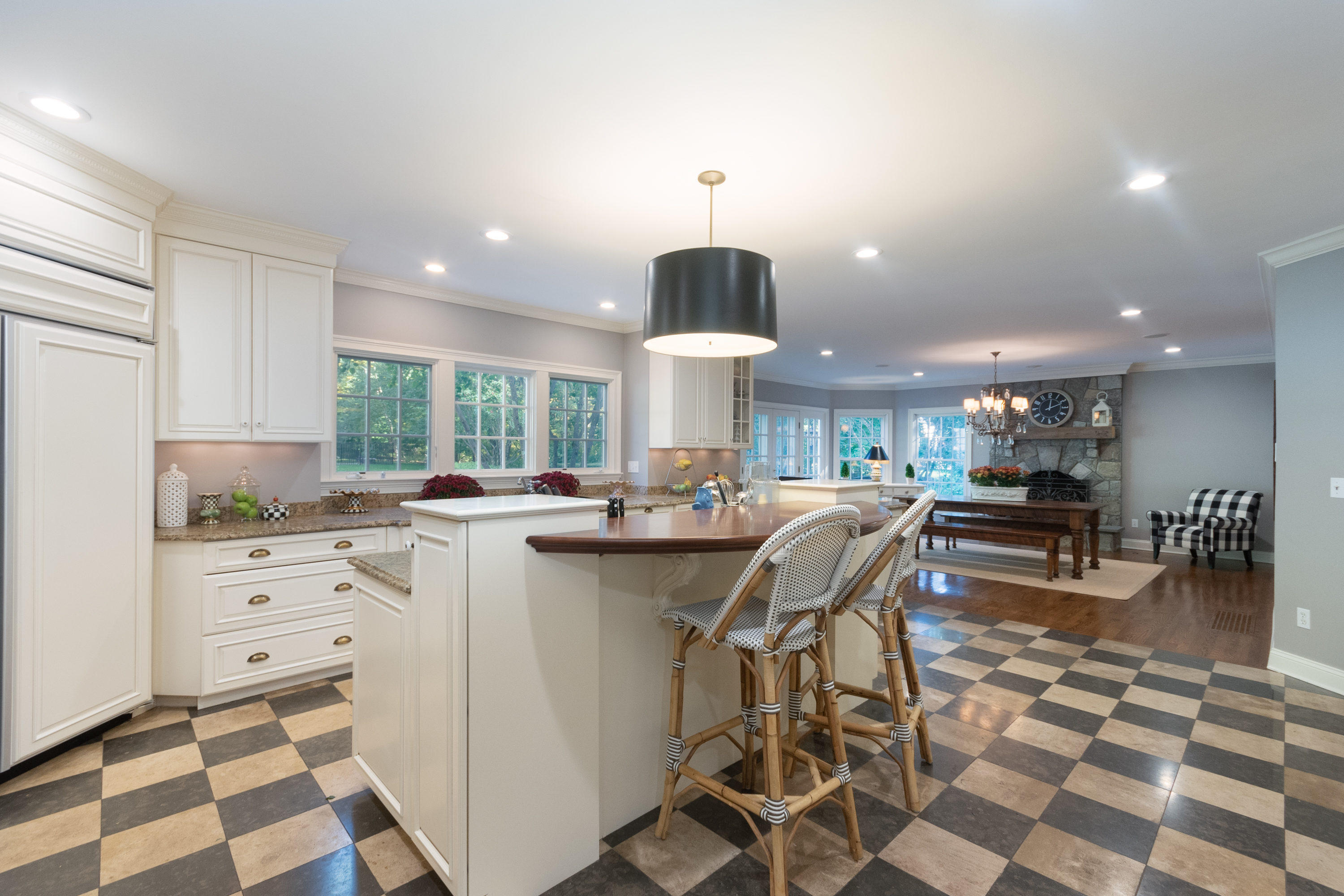 16 Shagbark Road Darien, CT 06820 - Photo 17 of 55 a kitchen with stainless steel appliances kitchen island granite countertop a sink a stove a dining table and chairs