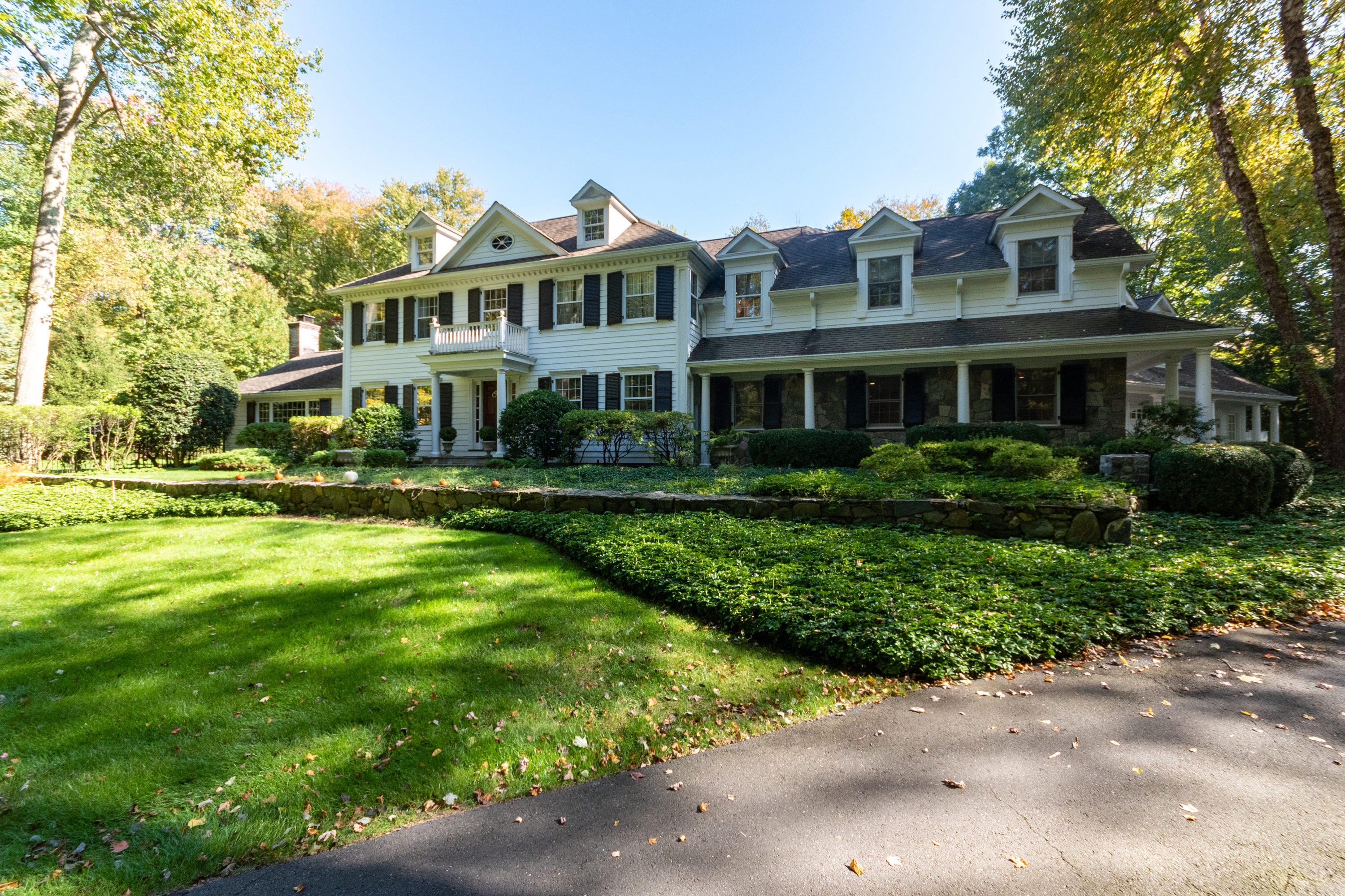 16 Shagbark Road Darien, CT 06820 - Photo 3 of 55 a front view of a house with a yard
