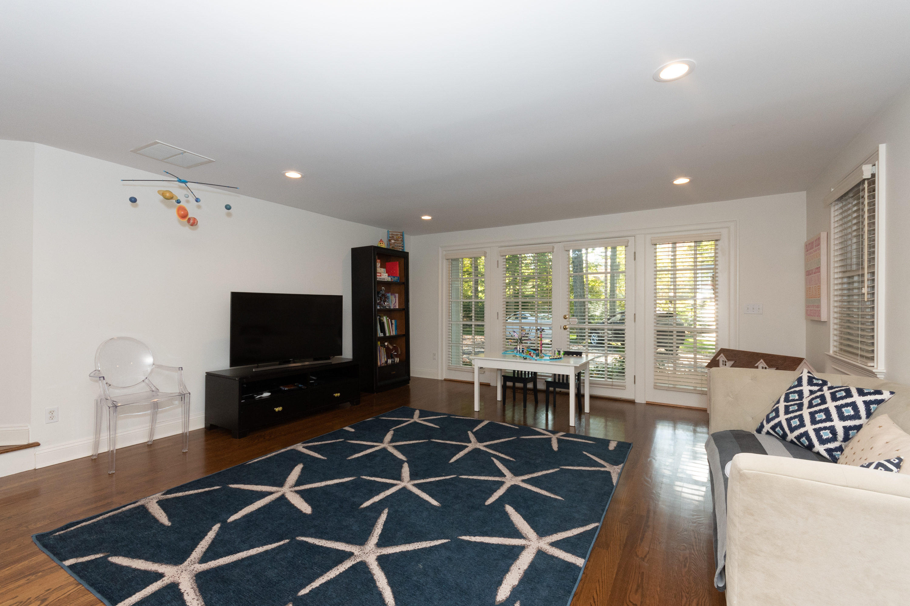 16 Shagbark Road Darien, CT 06820 - Photo 23 of 55 a living room with furniture and a flat screen tv