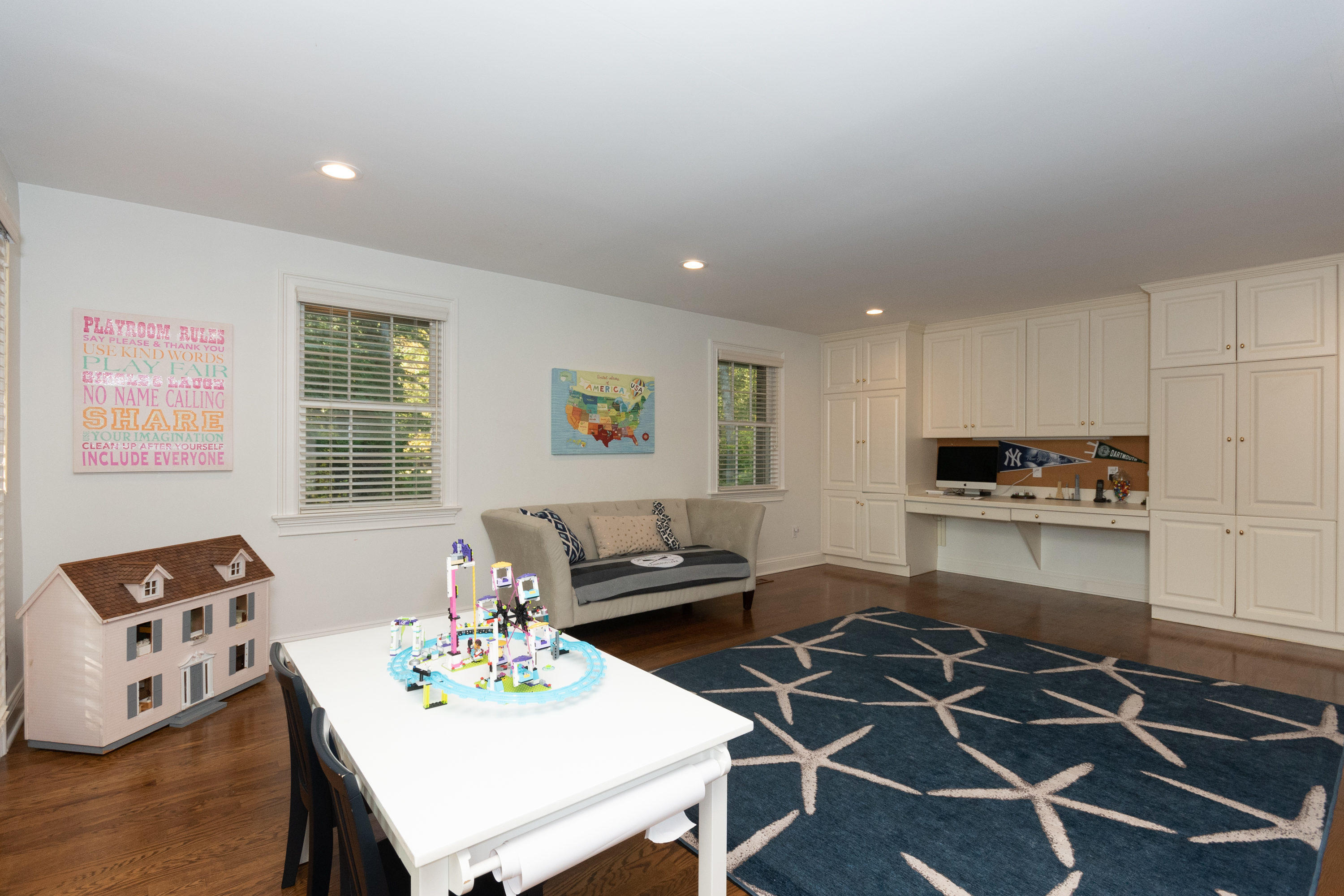 16 Shagbark Road Darien, CT 06820 - Photo 24 of 55 a living room with furniture and a dining table with wooden floor