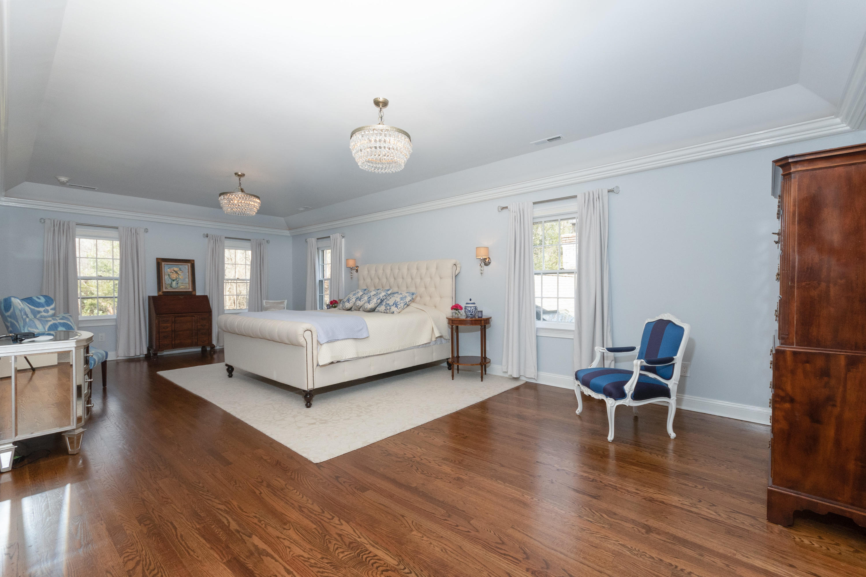 16 Shagbark Road Darien, CT 06820 - Photo 27 of 55 a living room with furniture and a dining table with wooden floor