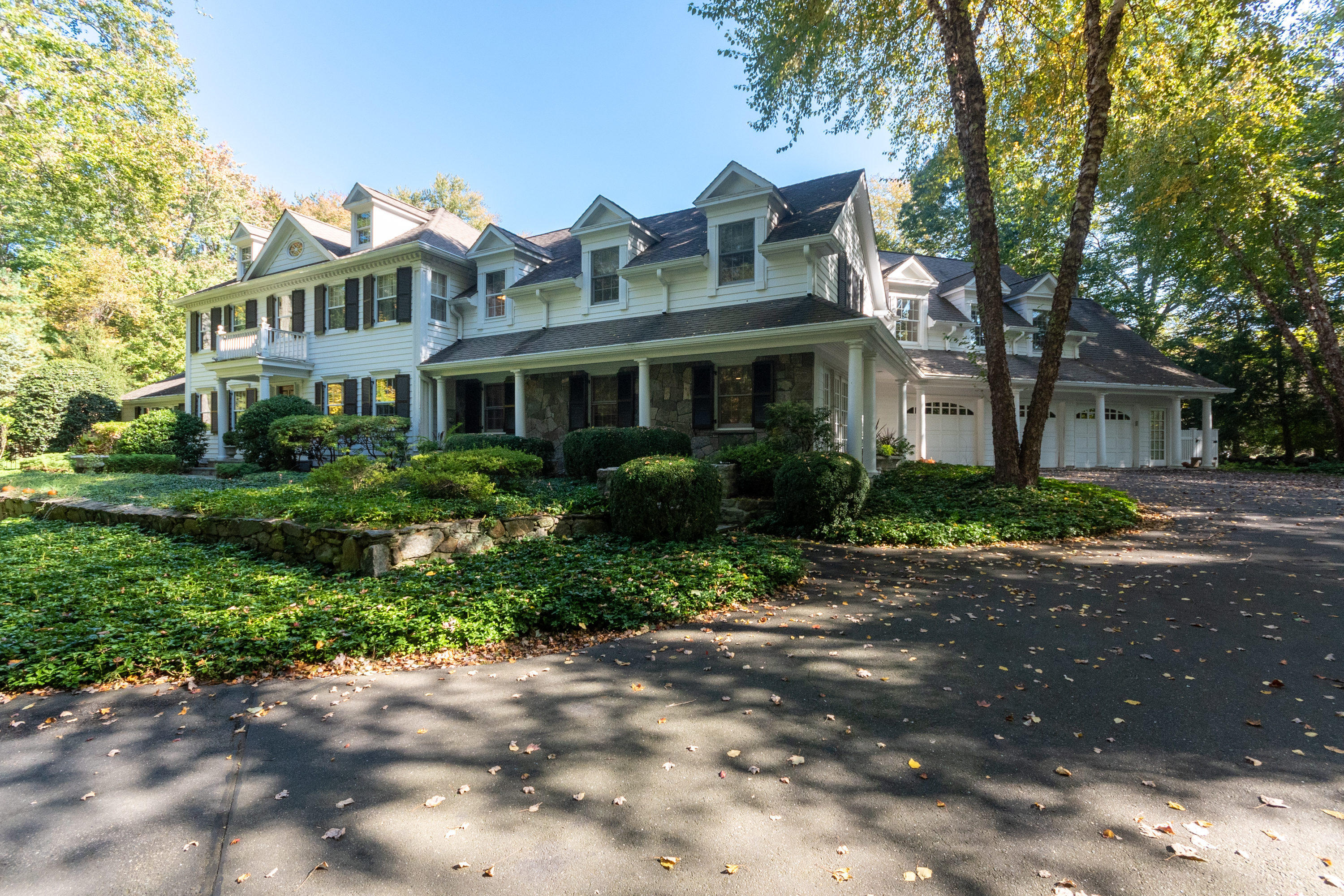16 Shagbark Road Darien, CT 06820 - Photo 4 of 55 a front view of a house with a garden