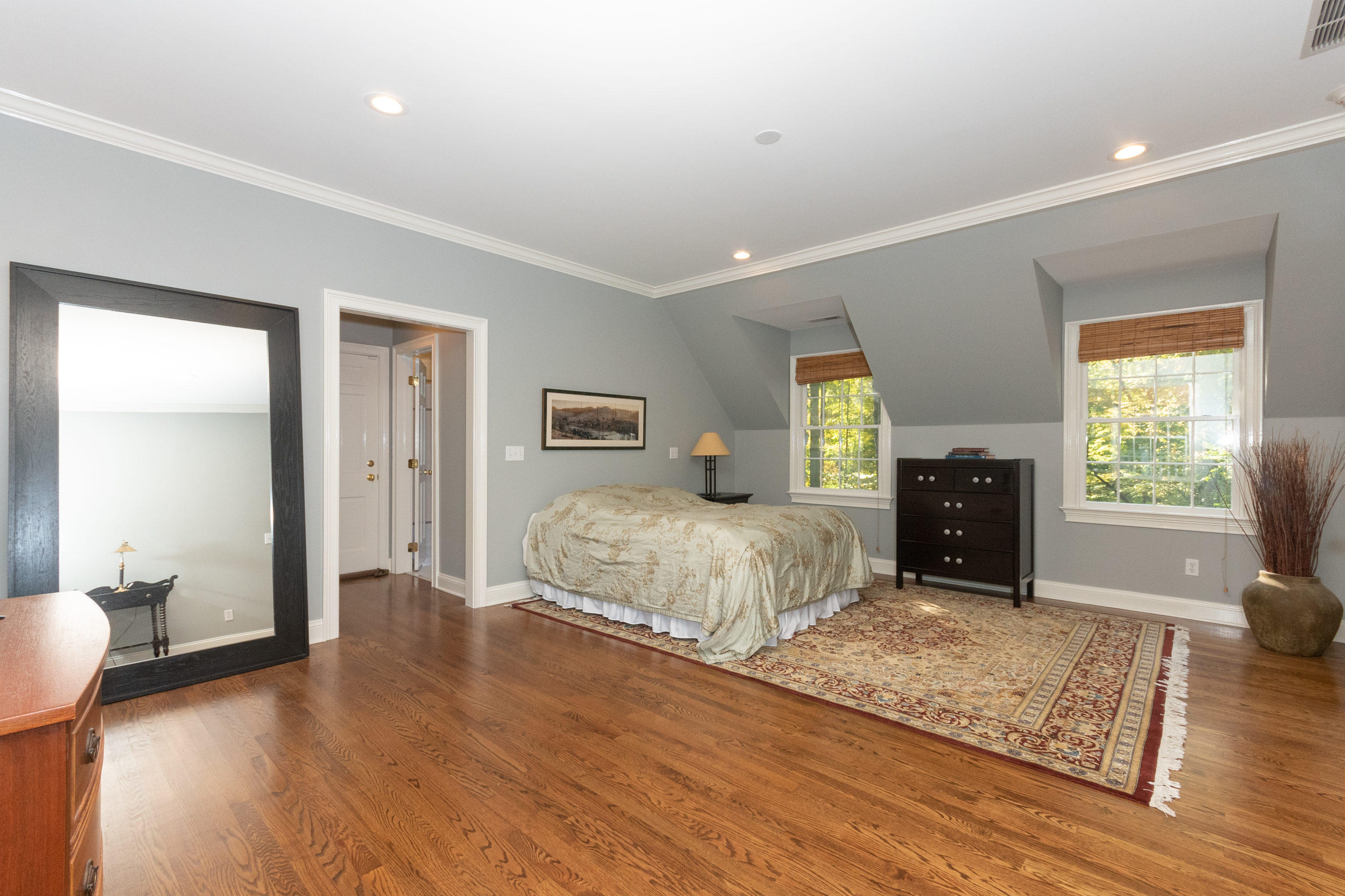 16 Shagbark Road Darien, CT 06820 - Photo 33 of 55 a spacious bedroom with a large bed and a window