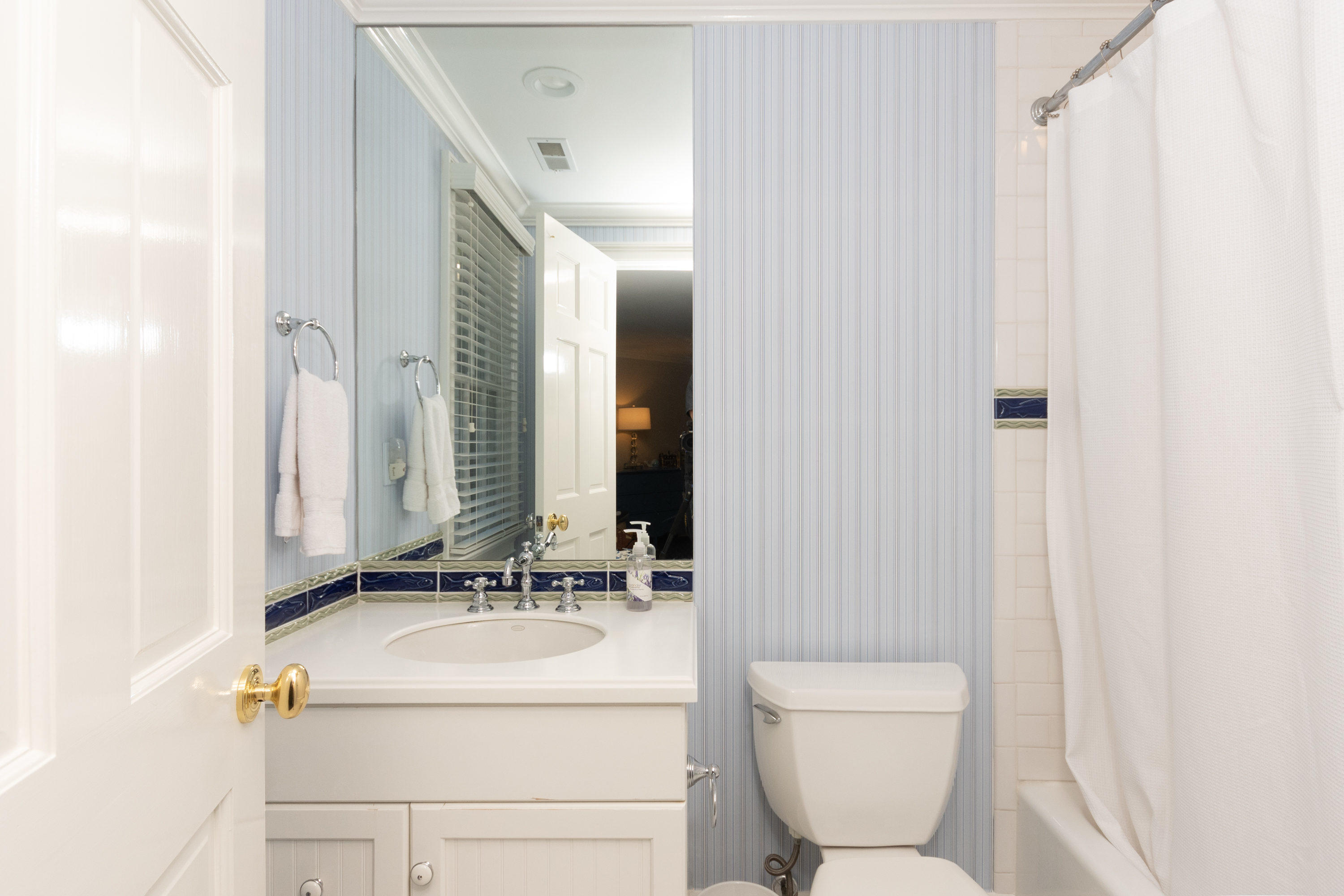 16 Shagbark Road Darien, CT 06820 - Photo 36 of 55 a bathroom with a sink a toilet and a mirror